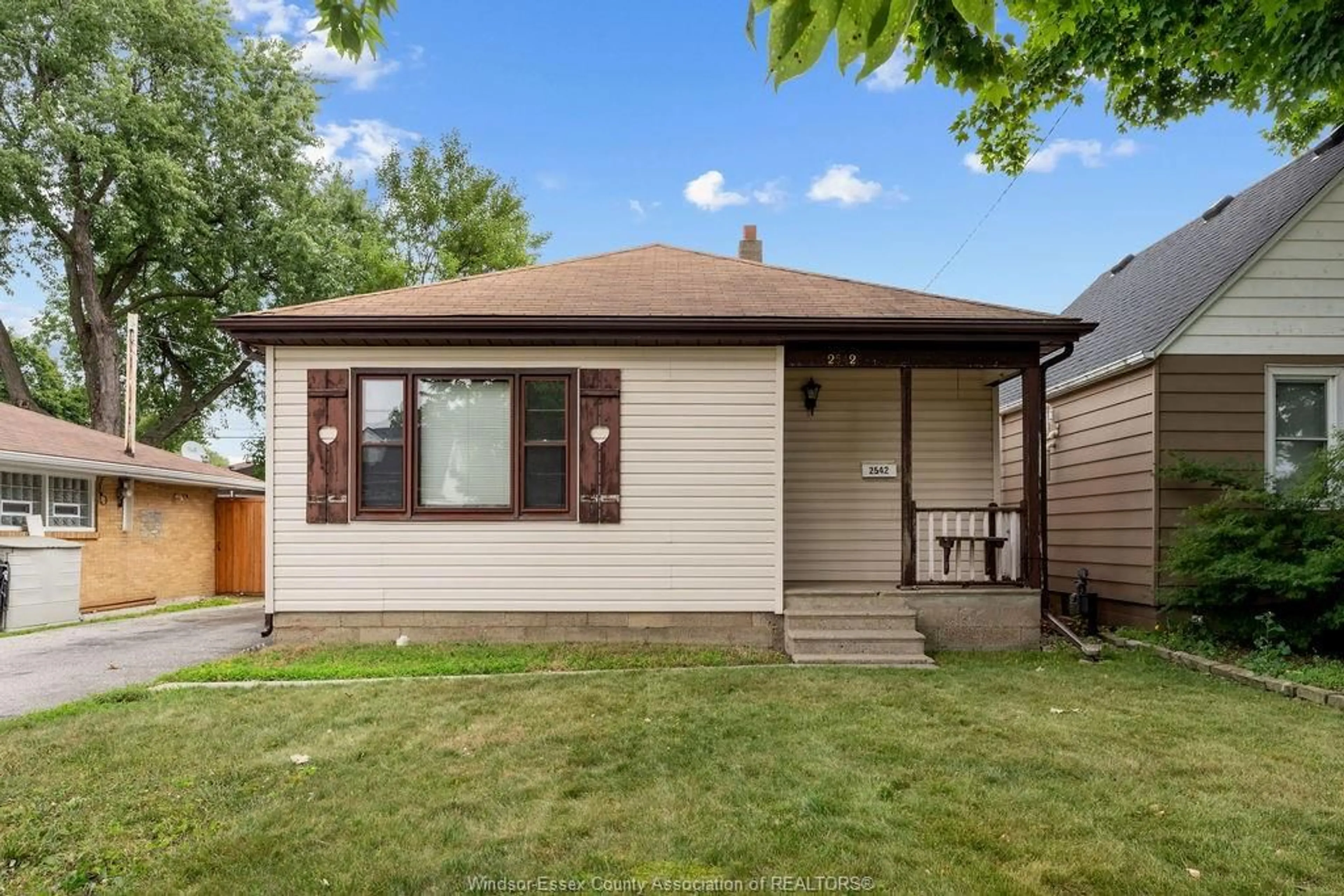 Home with vinyl exterior material, street for 2542 TOURANGEAU, Windsor Ontario N8W 4N9