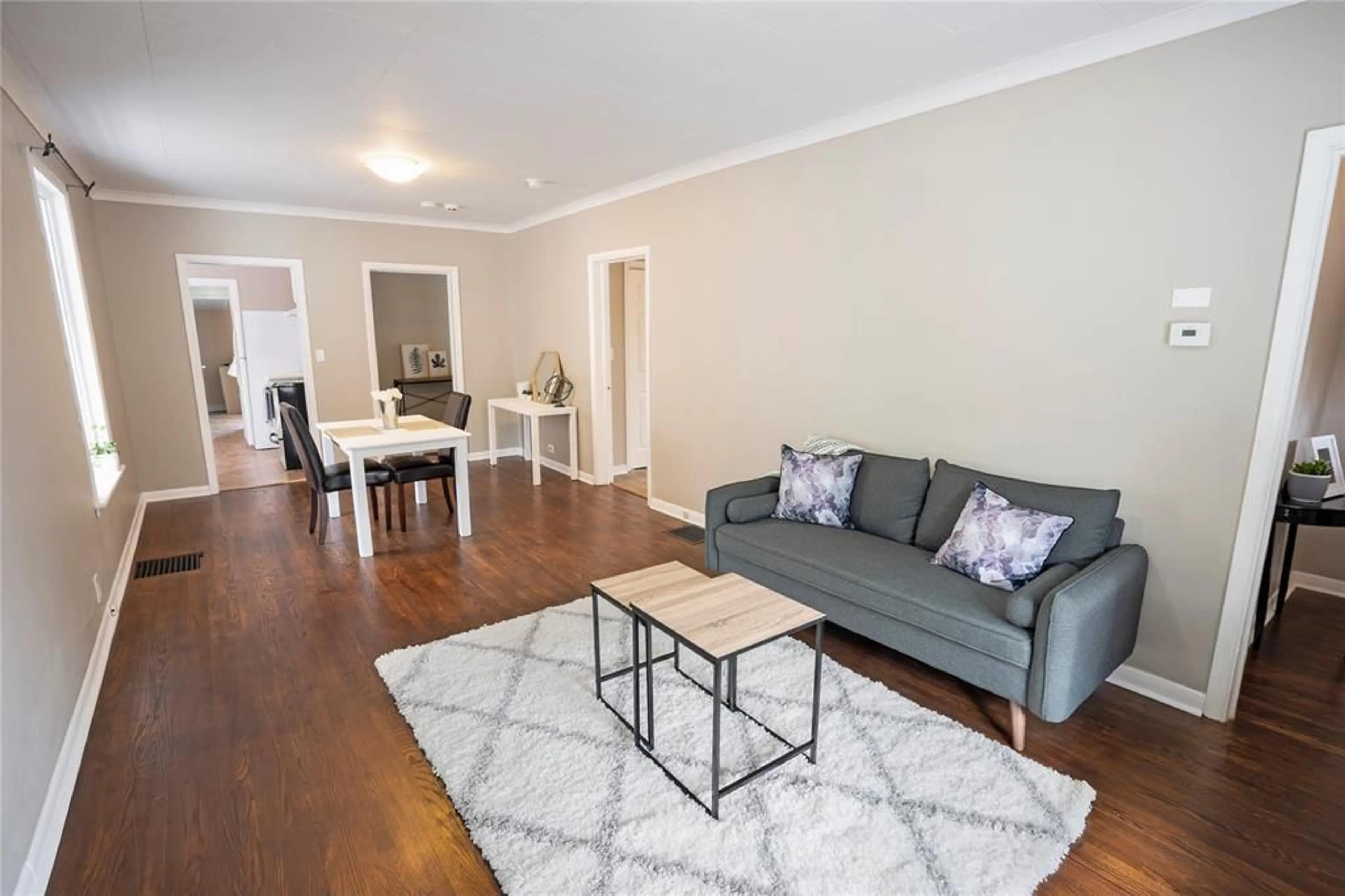 Living room with furniture, wood/laminate floor for 254 DURAND St, Sarnia Ontario N7T 5A3