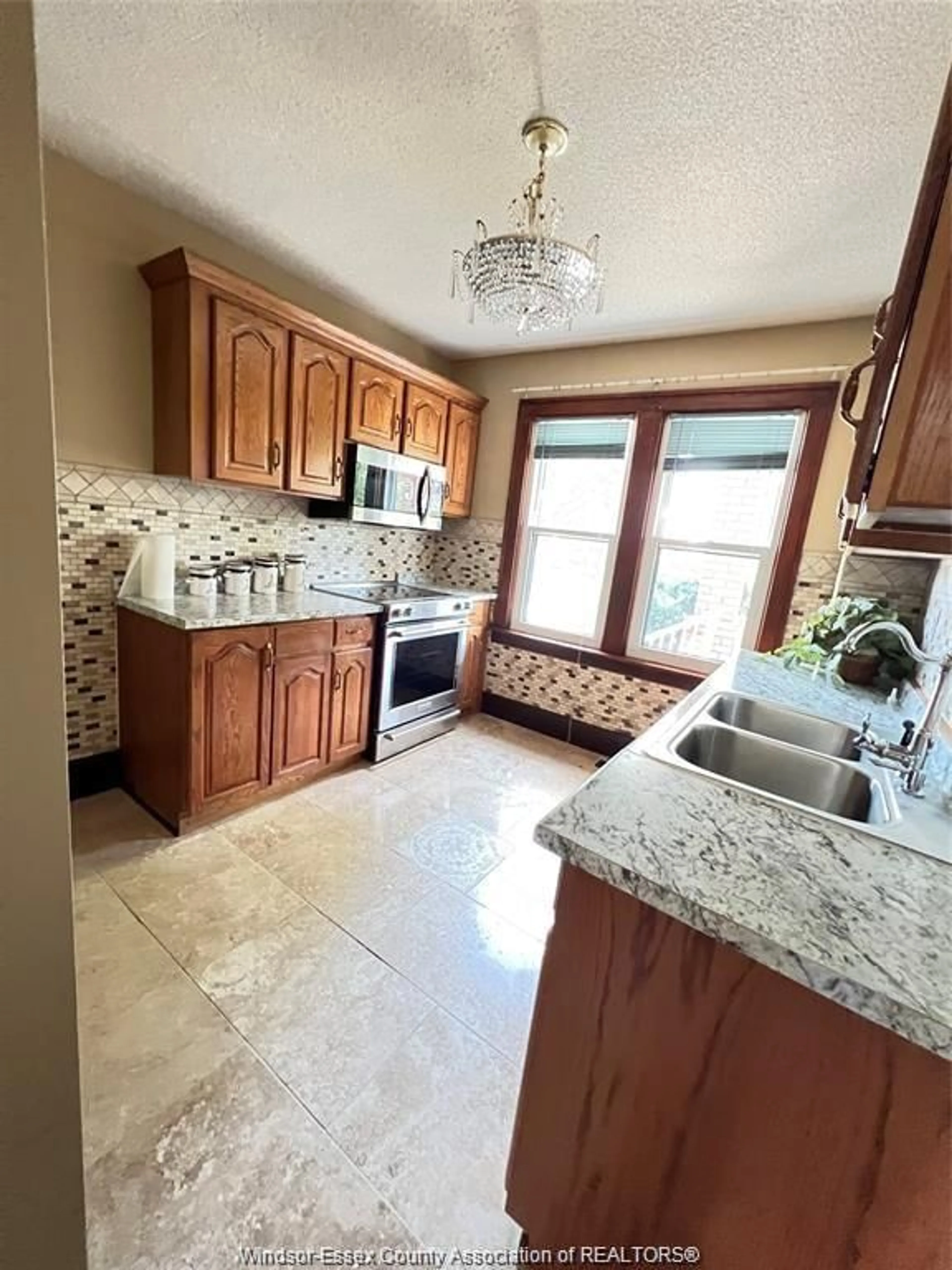 Open concept kitchen, ceramic/tile floor for 1951 TOURANGEAU Rd, Windsor Ontario N8W 4N4