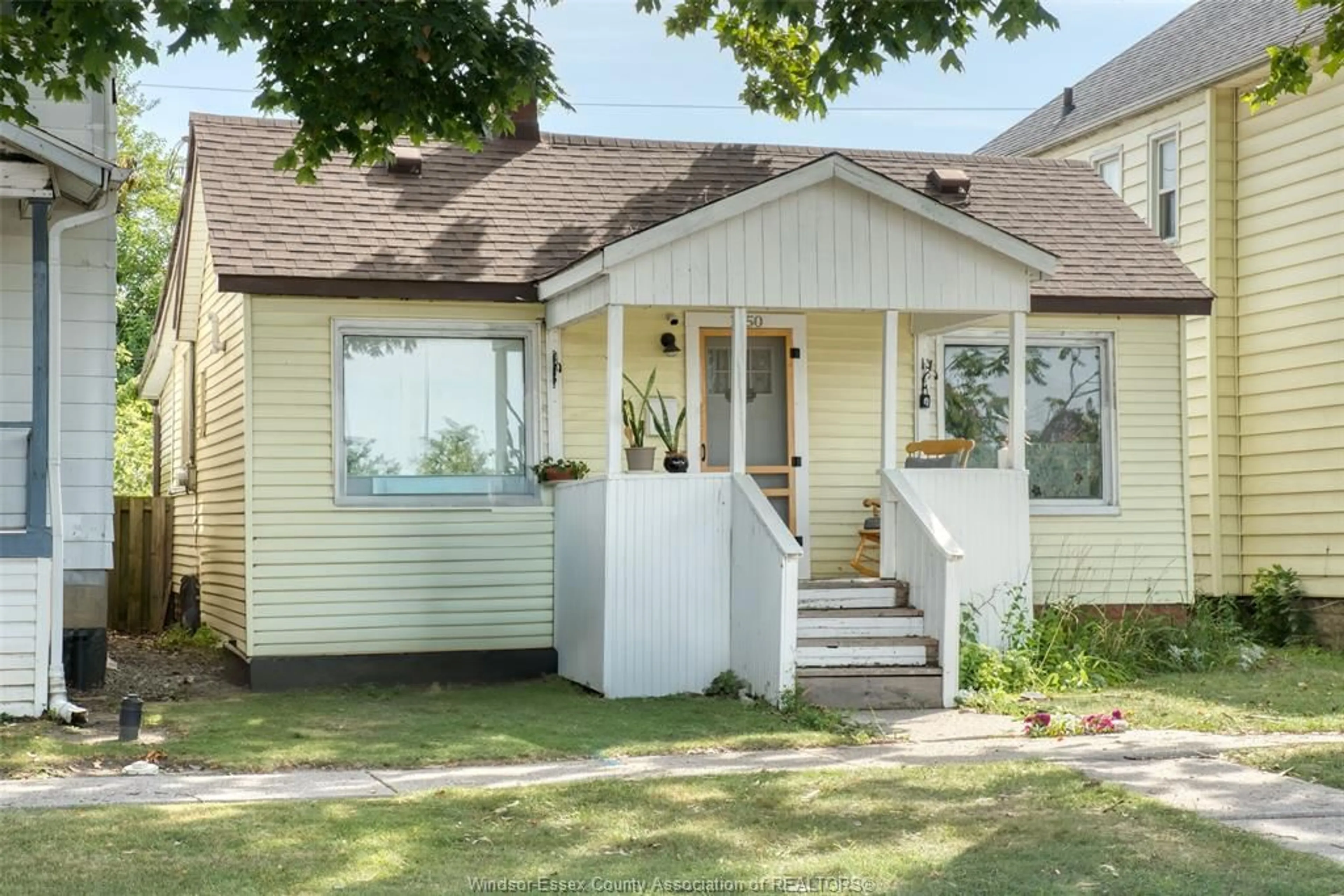 Home with vinyl exterior material, street for 1050 St. Luke Road, Windsor Ontario N8Y 3M8