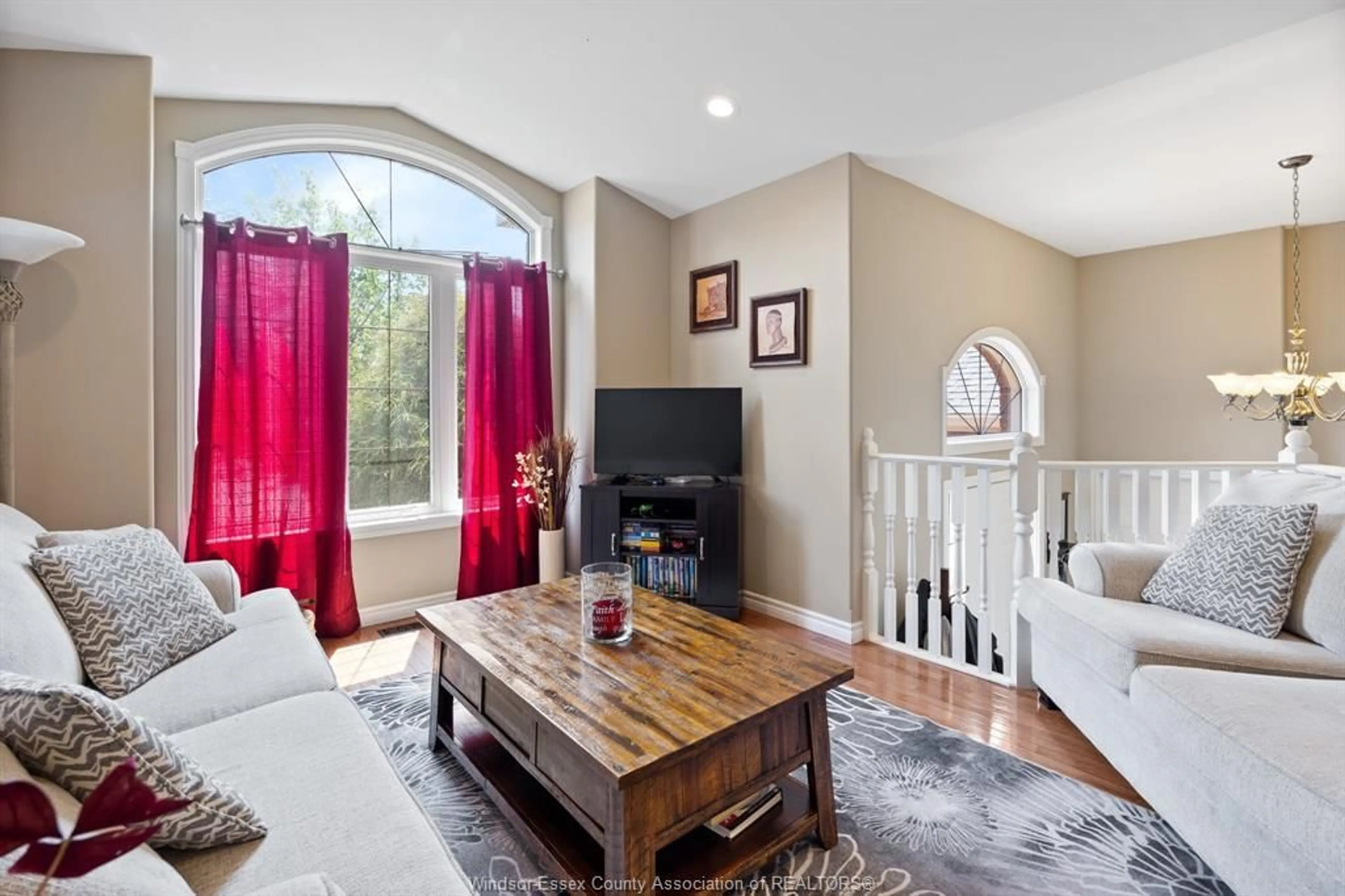 Living room with furniture, wood/laminate floor for 395 DONLON St, LaSalle Ontario N9J 3Y2