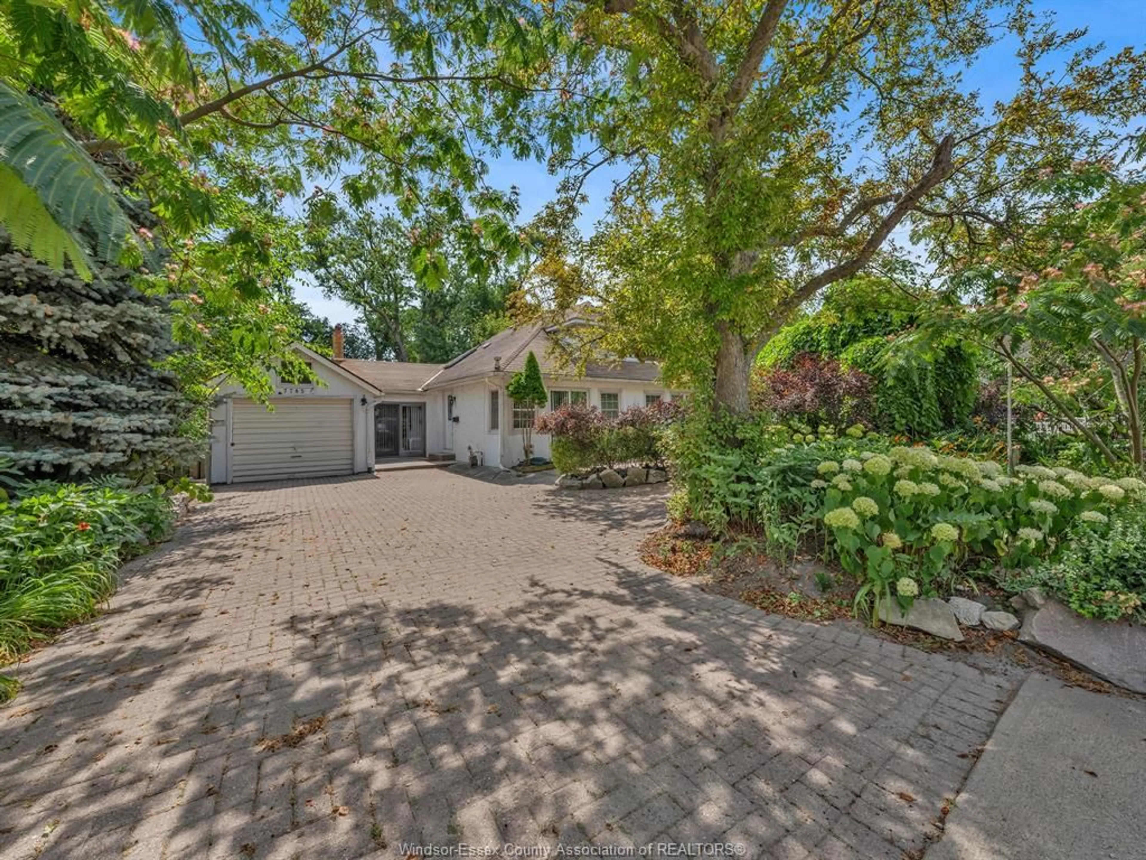 A pic from outside/outdoor area/front of a property/back of a property/a pic from drone, street for 7785 RIVERSIDE Dr, Windsor Ontario N8S 1E1