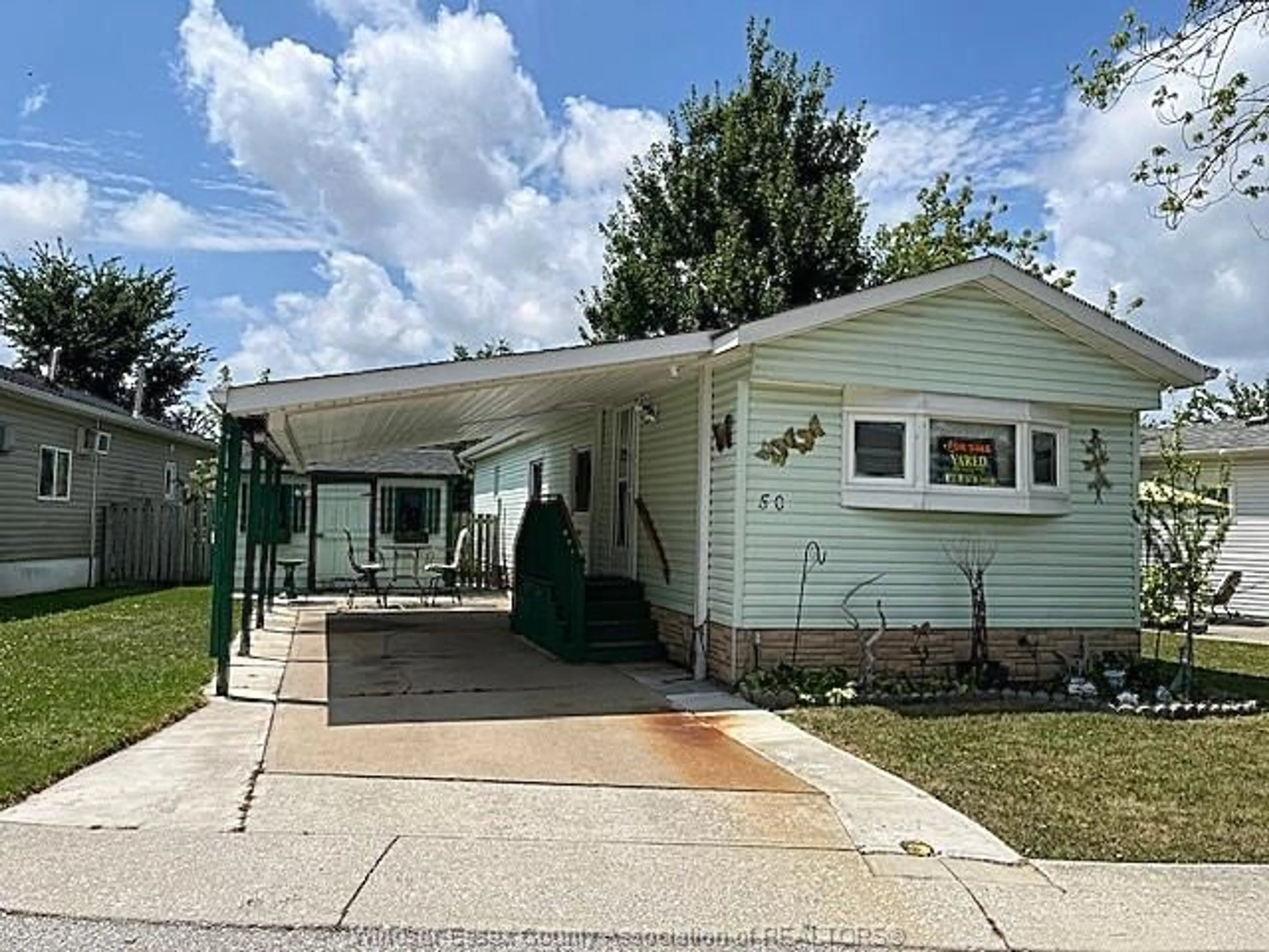 Home with vinyl exterior material, street for 50 PARKSIDE, McGregor Ontario N0R 1J0