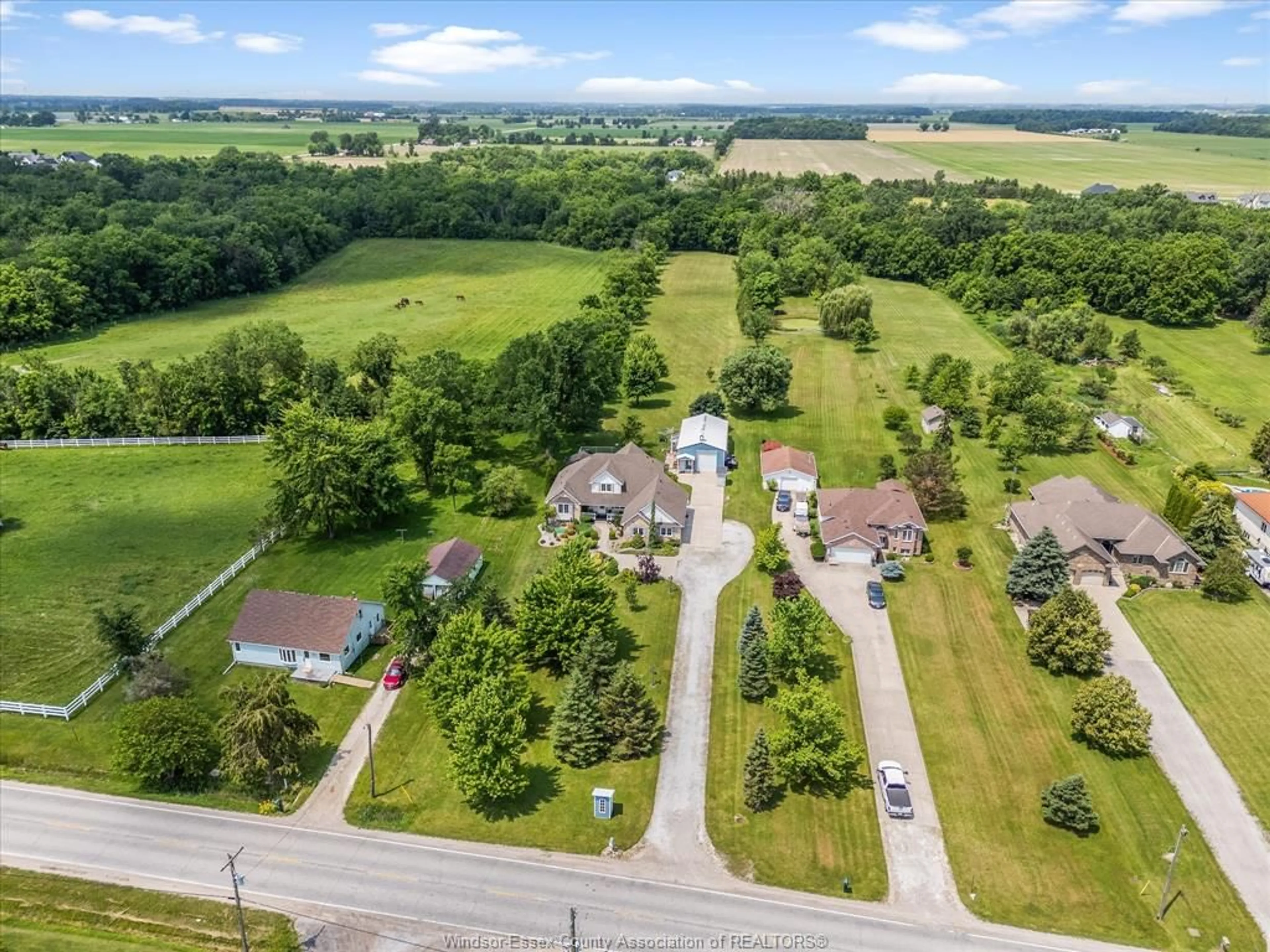 A pic from outside/outdoor area/front of a property/back of a property/a pic from drone, water/lake/river/ocean view for 2115 County Road 27, Lakeshore Ontario N0R 1V0