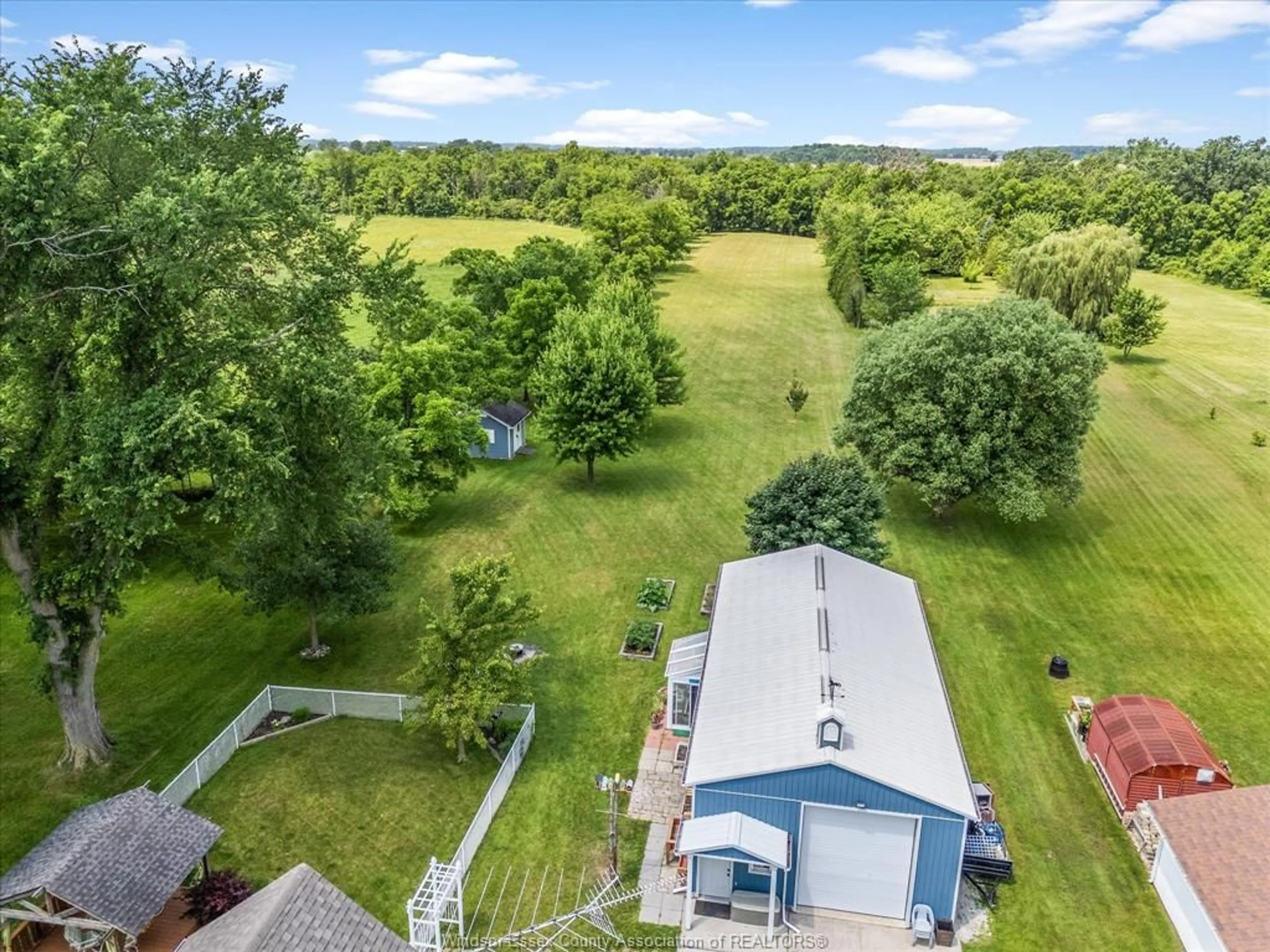 A pic from outside/outdoor area/front of a property/back of a property/a pic from drone, water/lake/river/ocean view for 2115 County Road 27, Lakeshore Ontario N0R 1V0