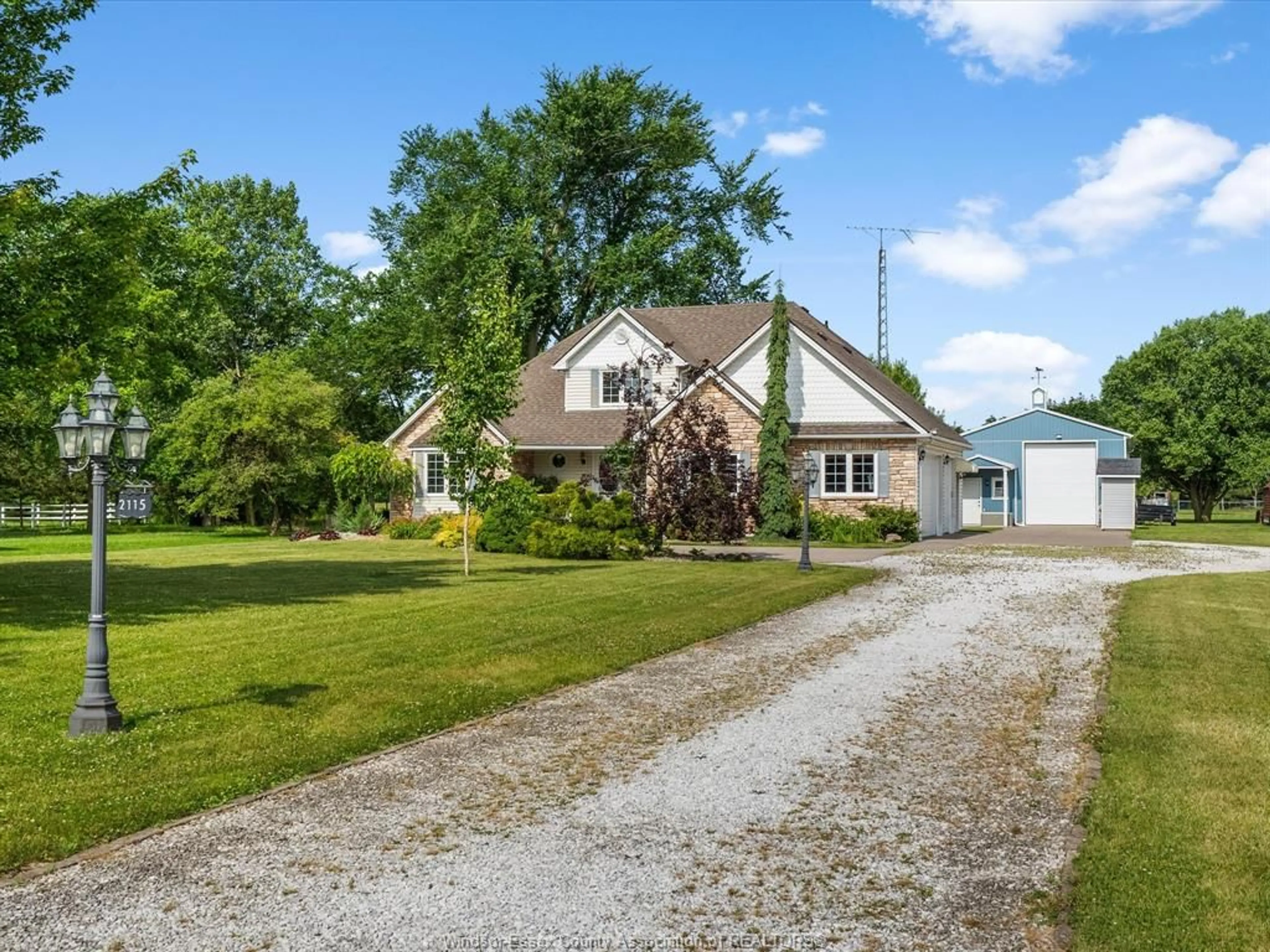 A pic from outside/outdoor area/front of a property/back of a property/a pic from drone, street for 2115 County Road 27, Lakeshore Ontario N0R 1V0