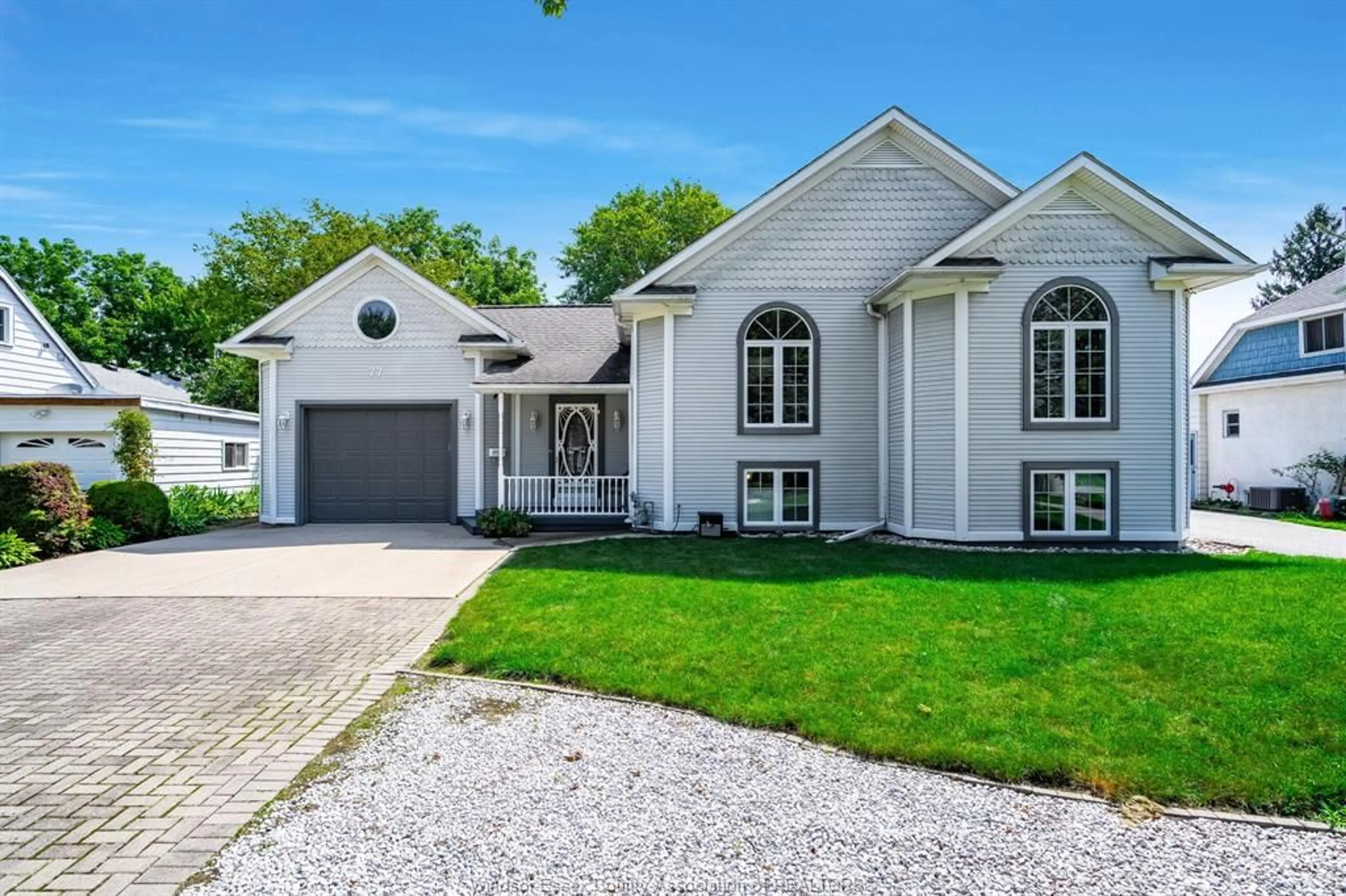 Home with vinyl exterior material, street for 77 Hodgins St, Leamington Ontario N8H 3N6
