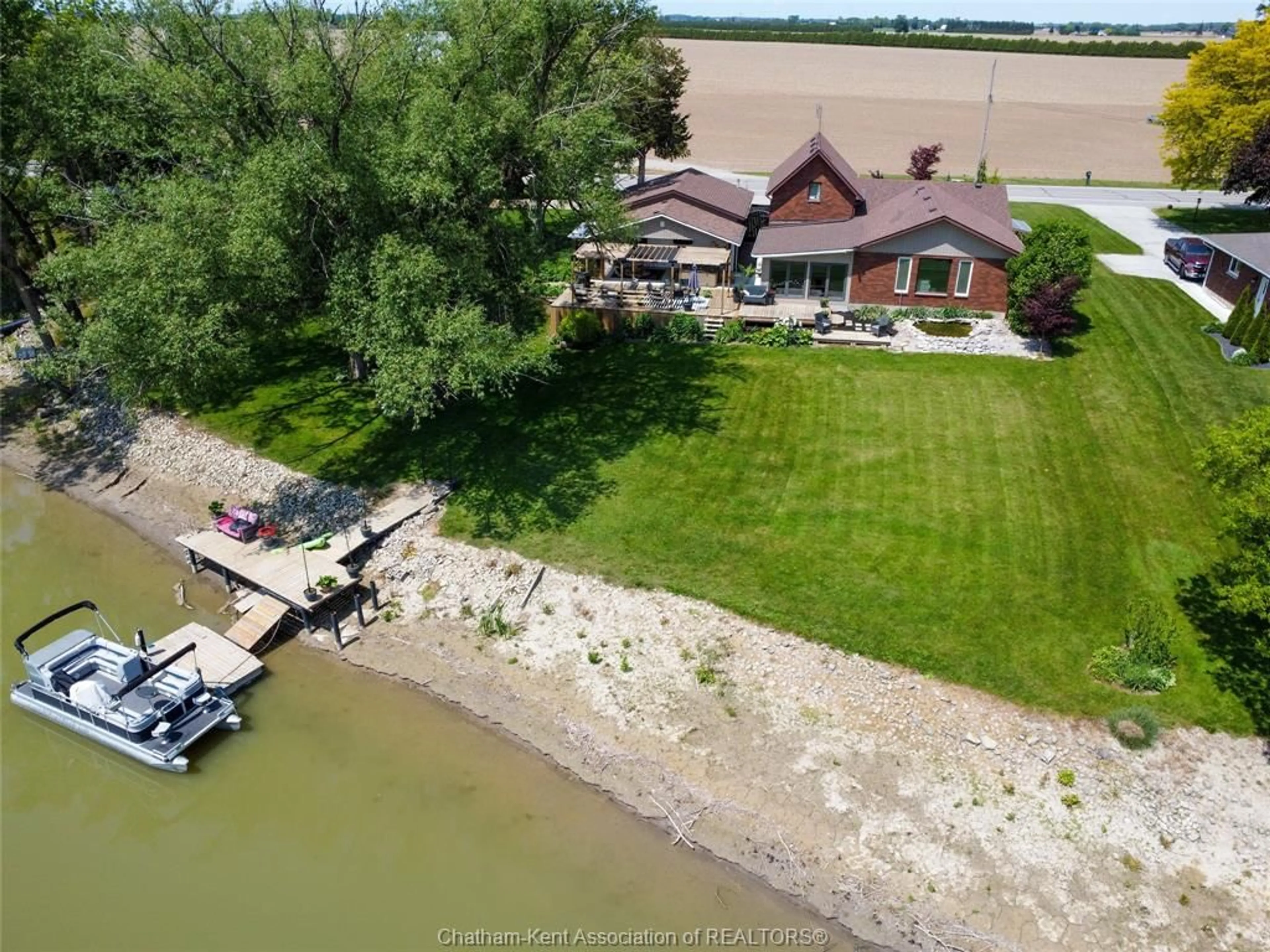 A pic from outside/outdoor area/front of a property/back of a property/a pic from drone, water/lake/river/ocean view for 7690 Grande River Line, Chatham-Kent Ontario N7M 5J7