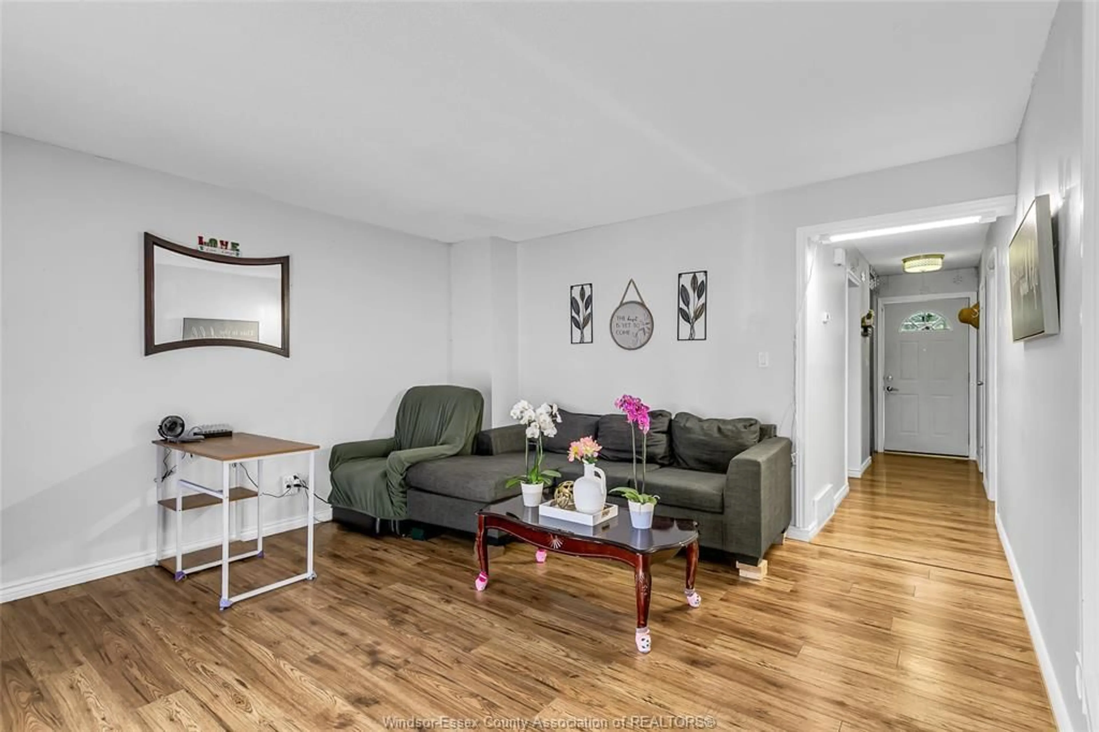 Living room with furniture, wood/laminate floor for 2994 Meadowbrook Lane #2, Windsor Ontario N8T 3G8