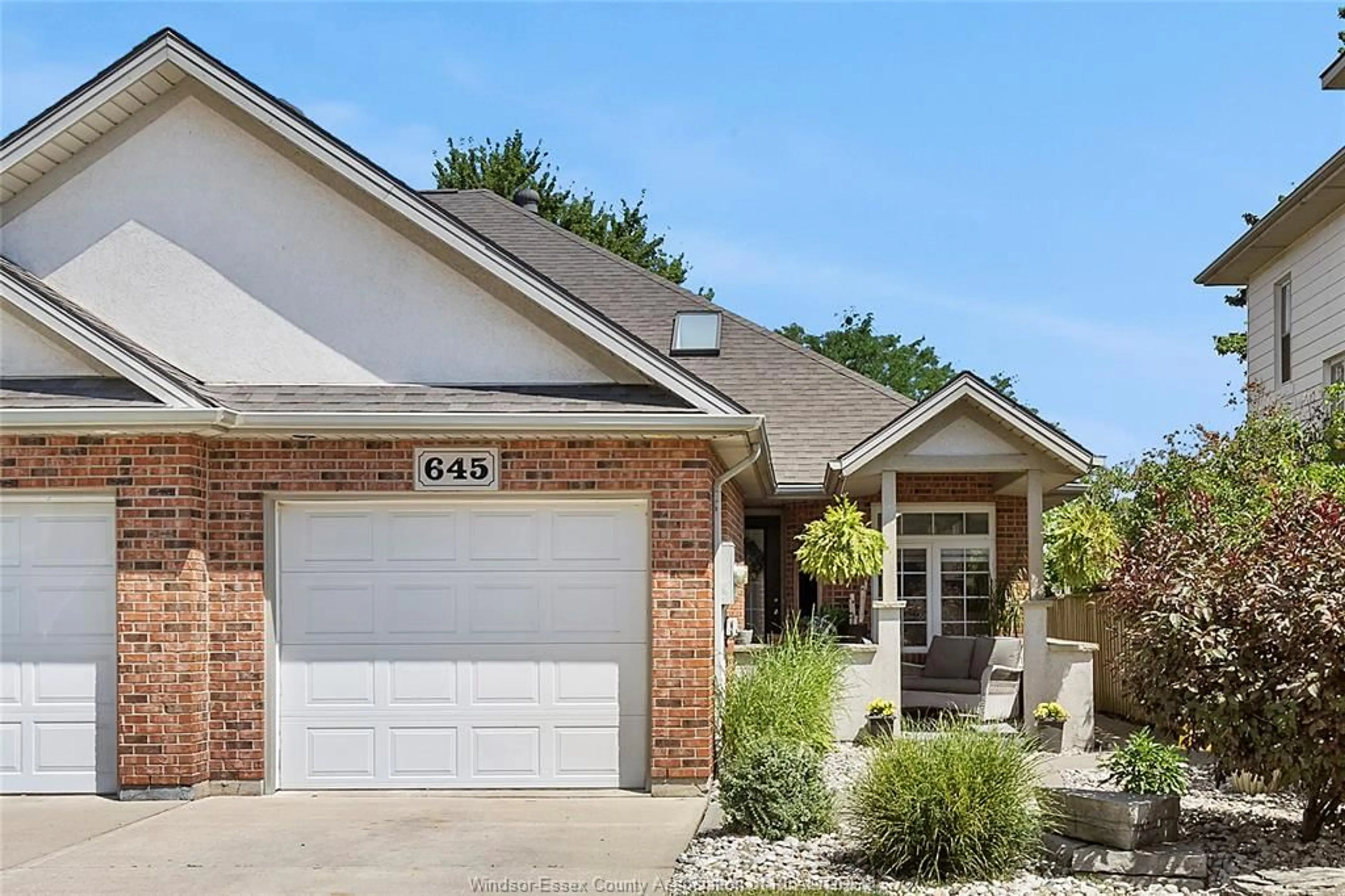 Home with brick exterior material, street for 645 ST. CHARLES, Lakeshore Ontario N0R 1A0