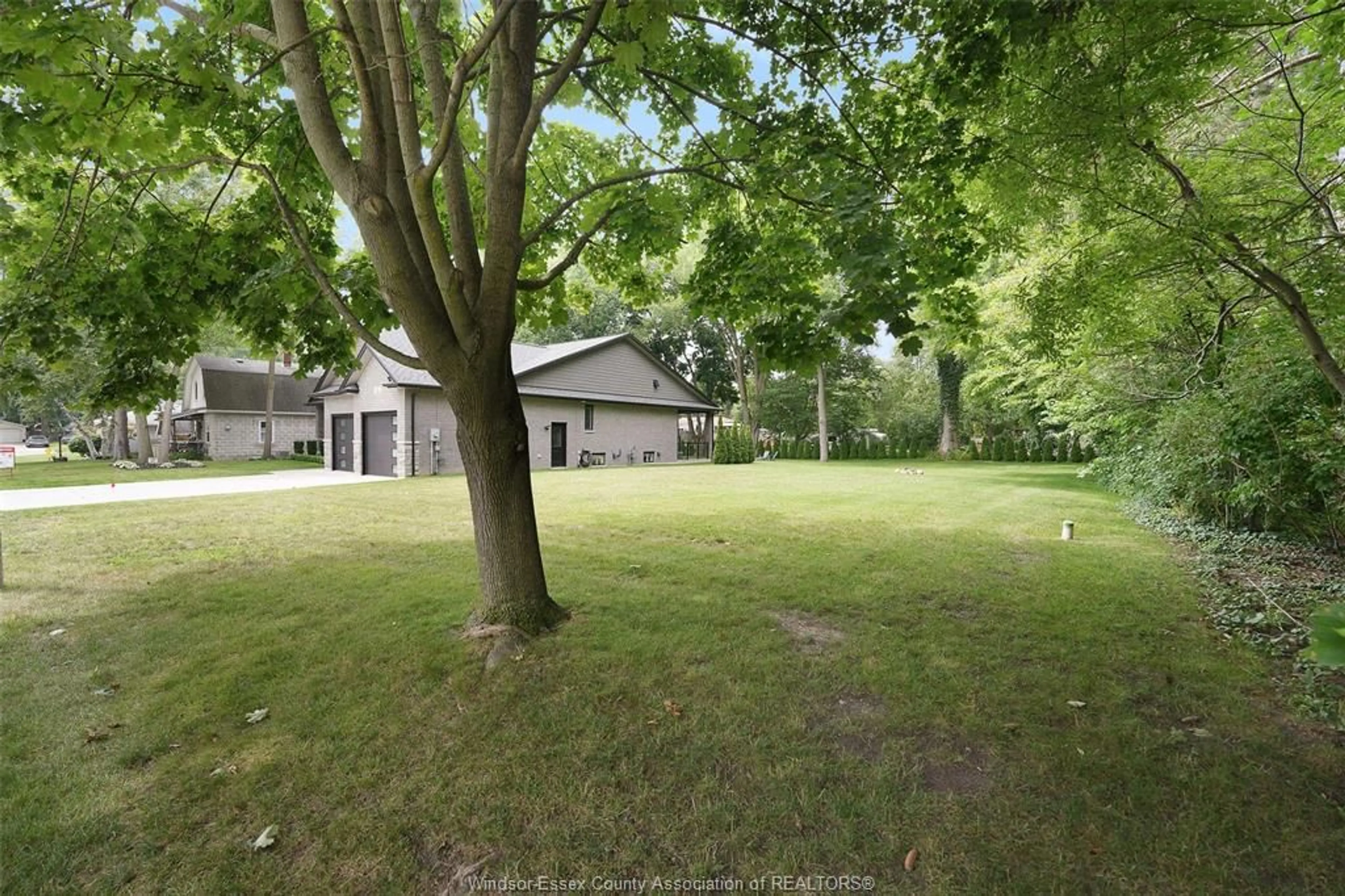 A pic from outside/outdoor area/front of a property/back of a property/a pic from drone, forest/trees view for 110 LAUREL St, Kingsville Ontario N9Y 2B4