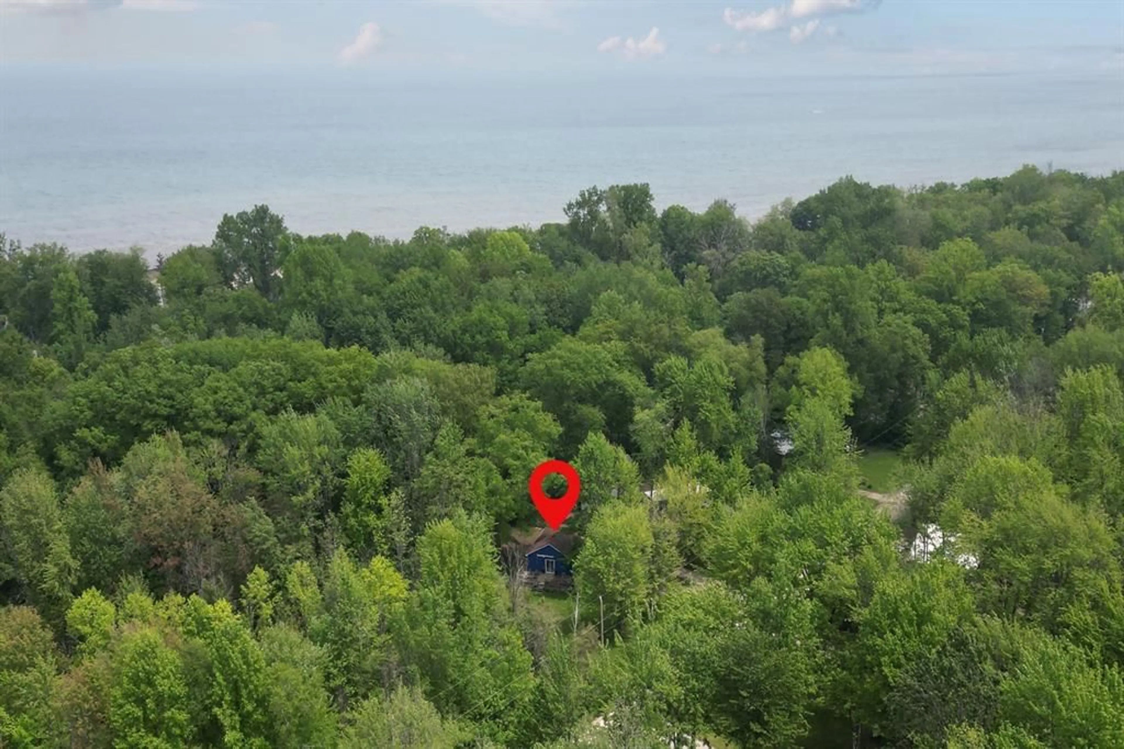 A pic from outside/outdoor area/front of a property/back of a property/a pic from drone, forest/trees view for 6078 Danbea Lane, Lambton Shores Ontario N0N 1J0