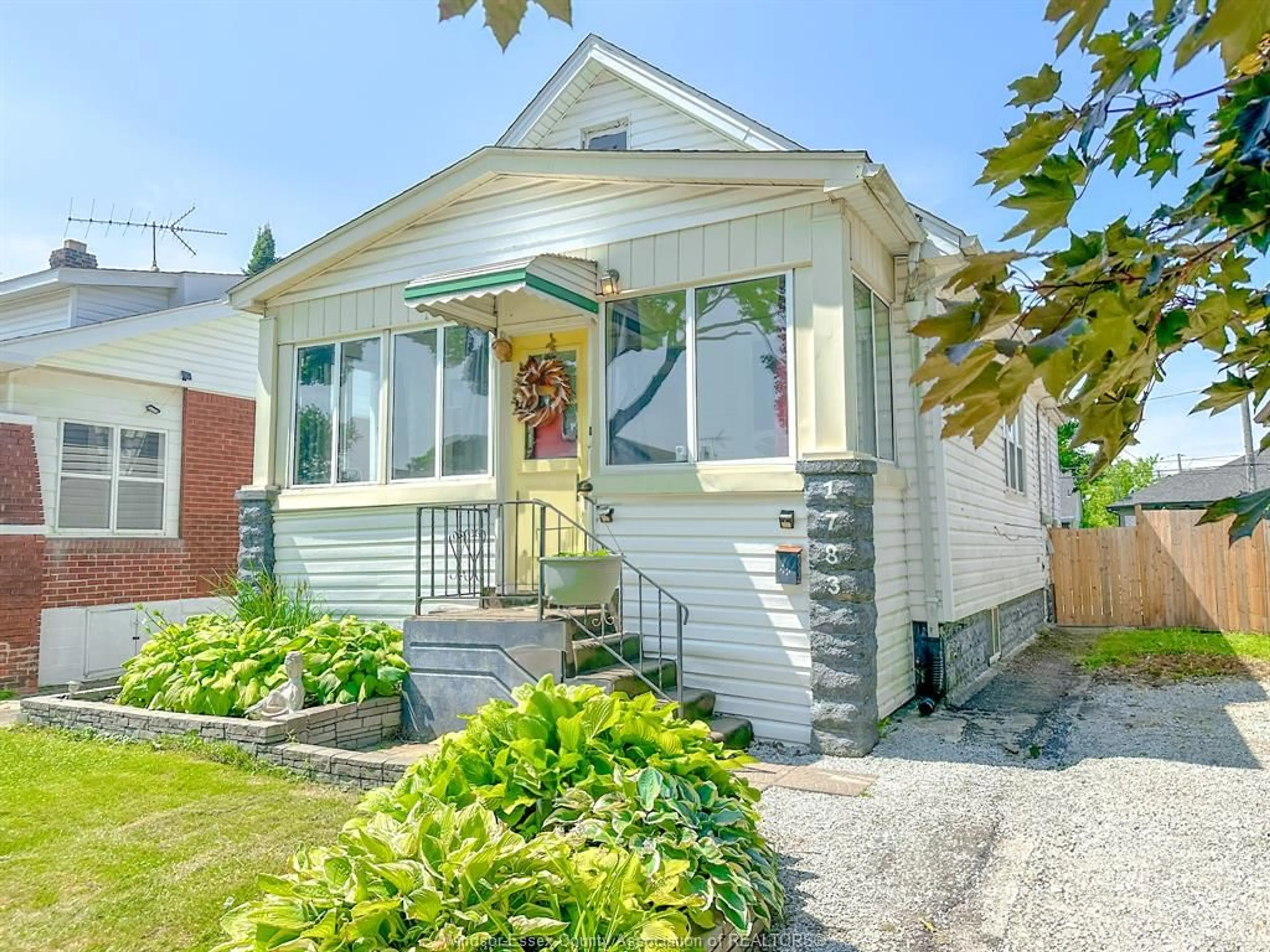 Home with vinyl exterior material, street for 1783 HALL, Windsor Ontario N8W 2L5