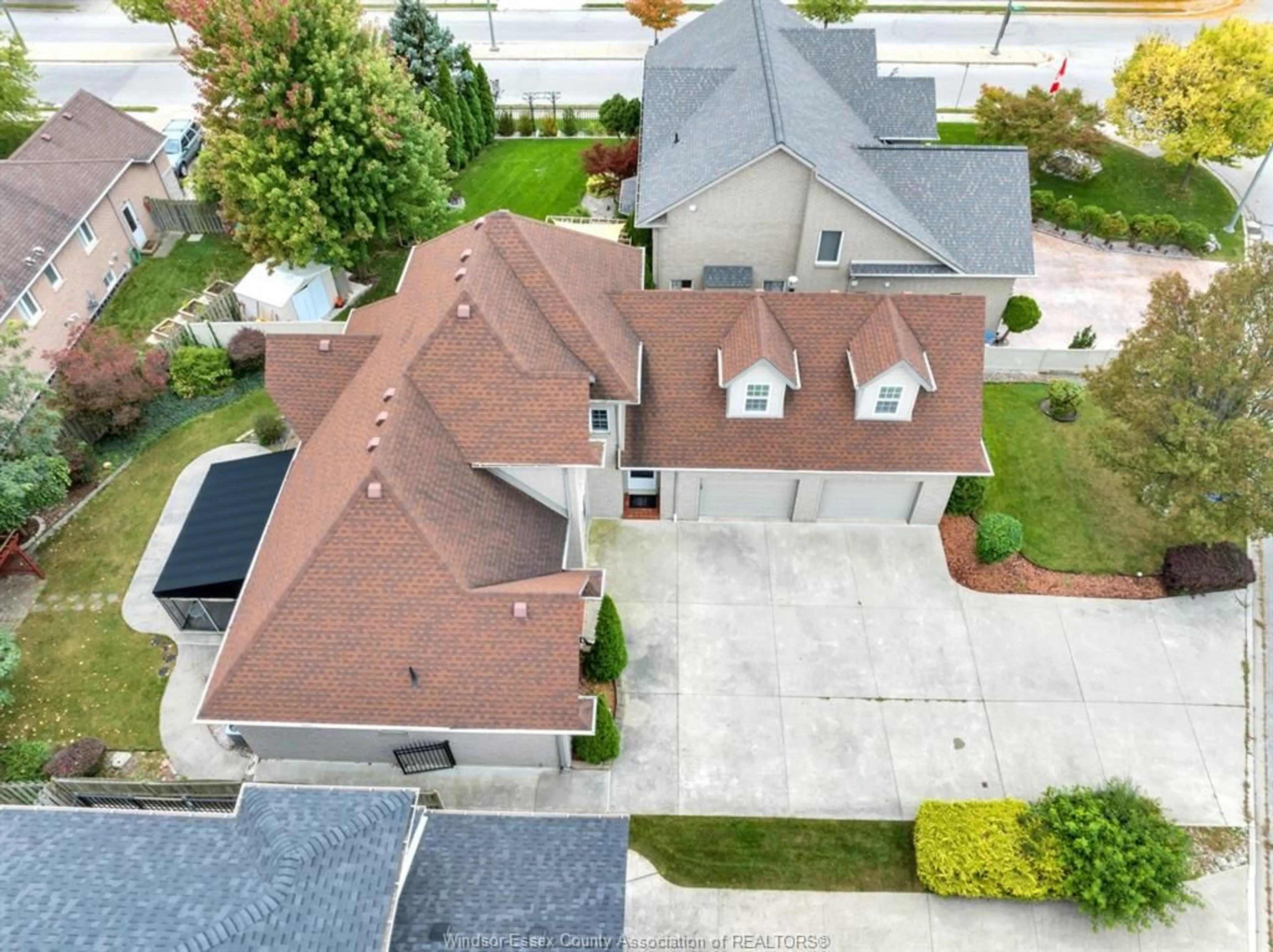 A pic from outside/outdoor area/front of a property/back of a property/a pic from drone, street for 11341 AMALFI DR. Dr, Windsor Ontario N8P 1J8
