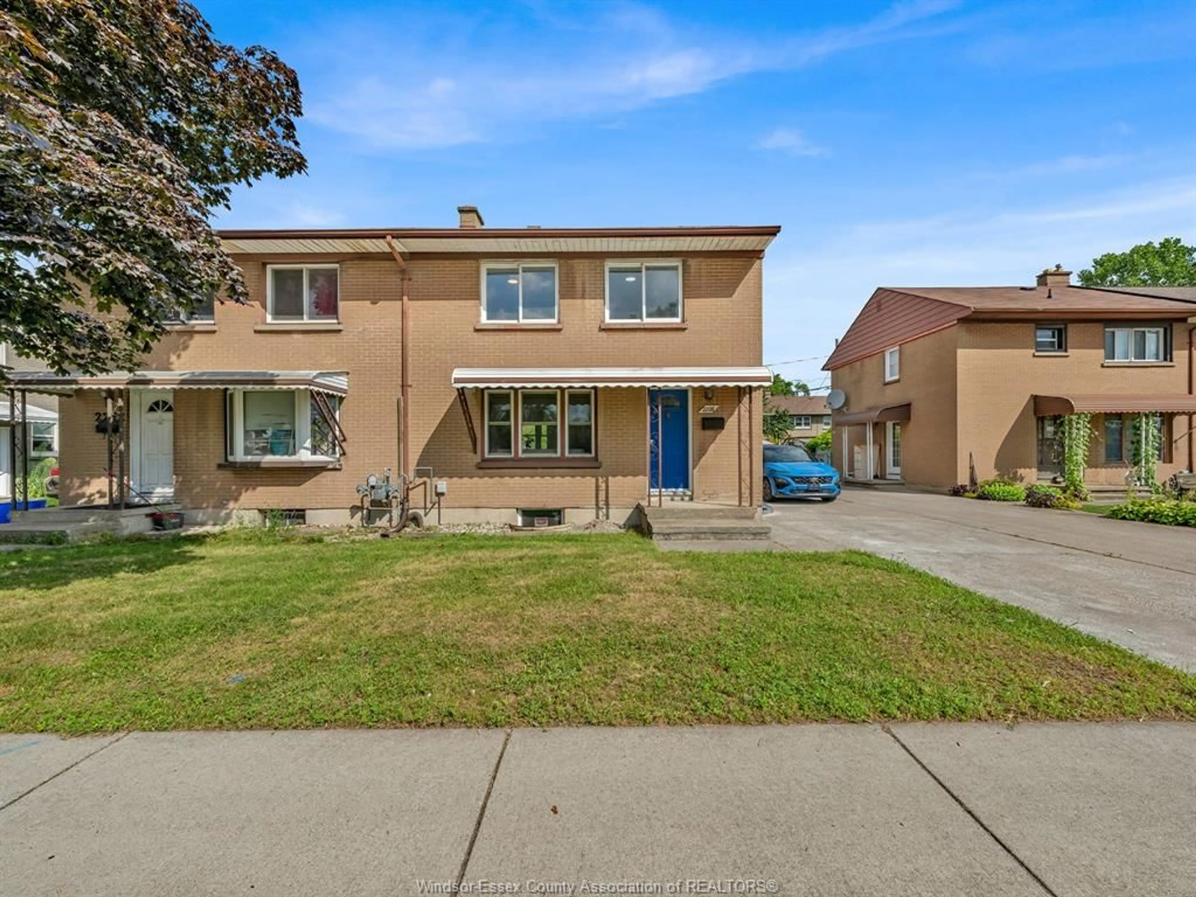 Home with brick exterior material, street for 2226 TECUMSEH Rd, Windsor Ontario N9B 1W1
