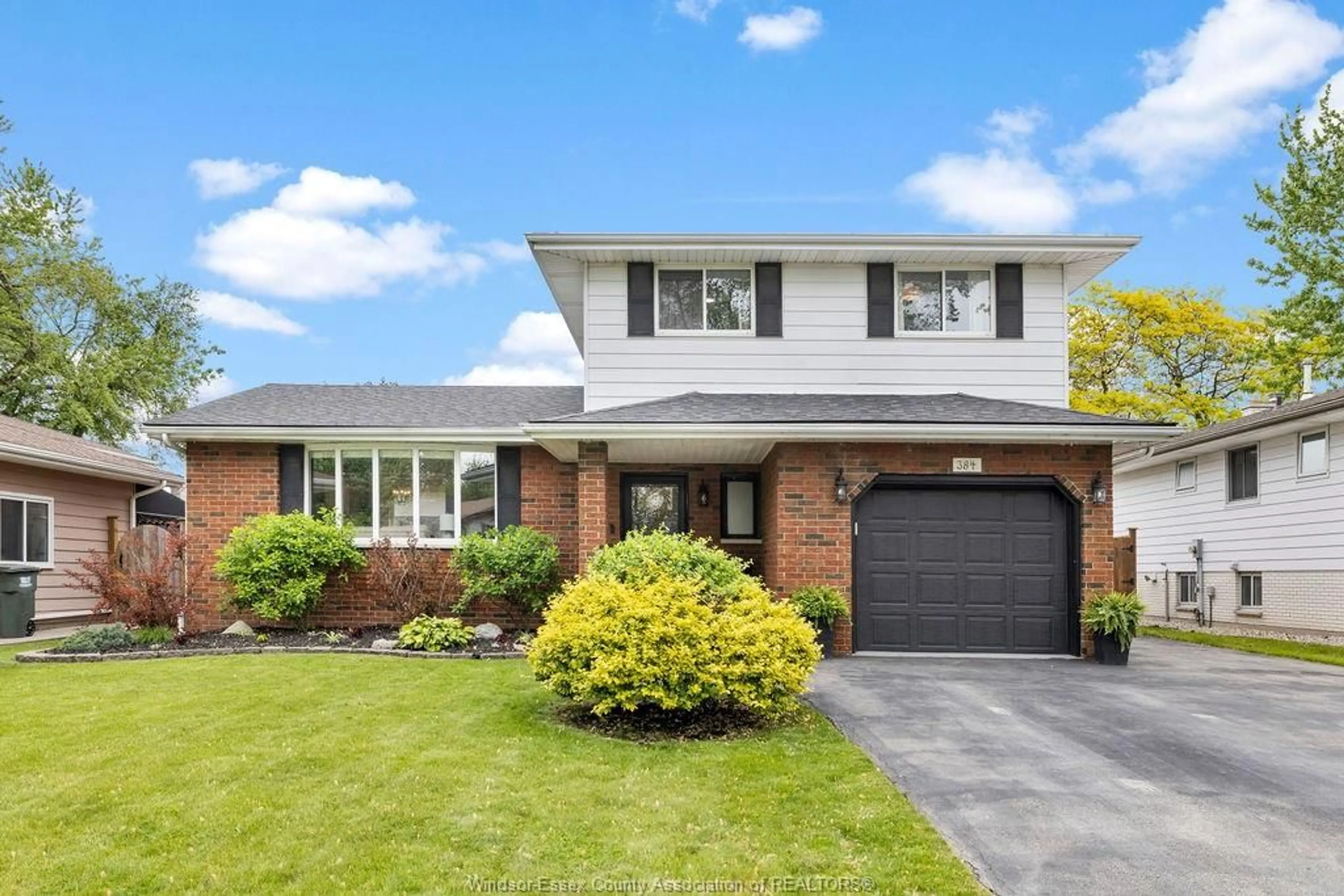 Home with brick exterior material, street for 384 CENTENNIAL Dr, Tecumseh Ontario N8N 2P2