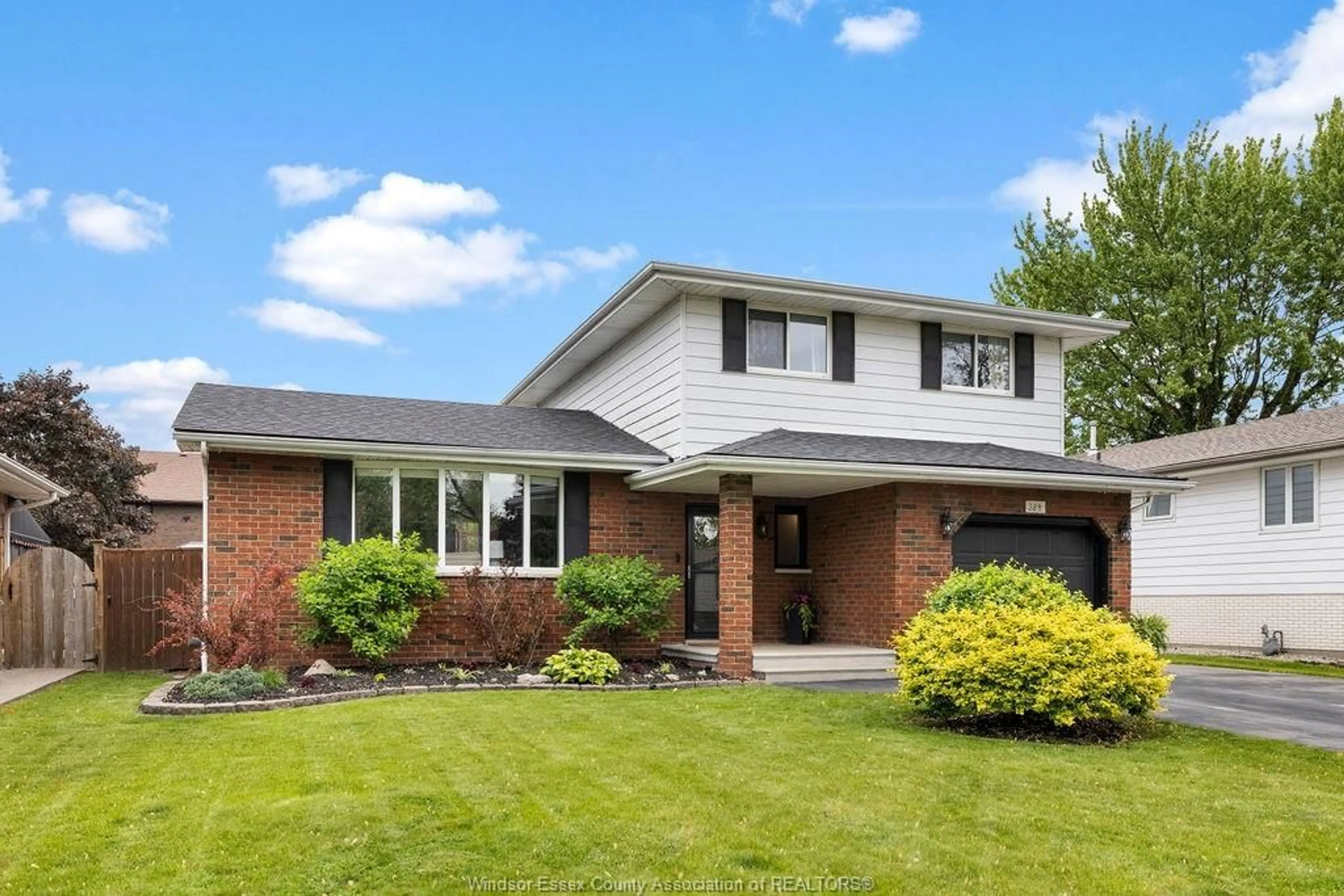 Home with brick exterior material, street for 384 CENTENNIAL Dr, Tecumseh Ontario N8N 2P2