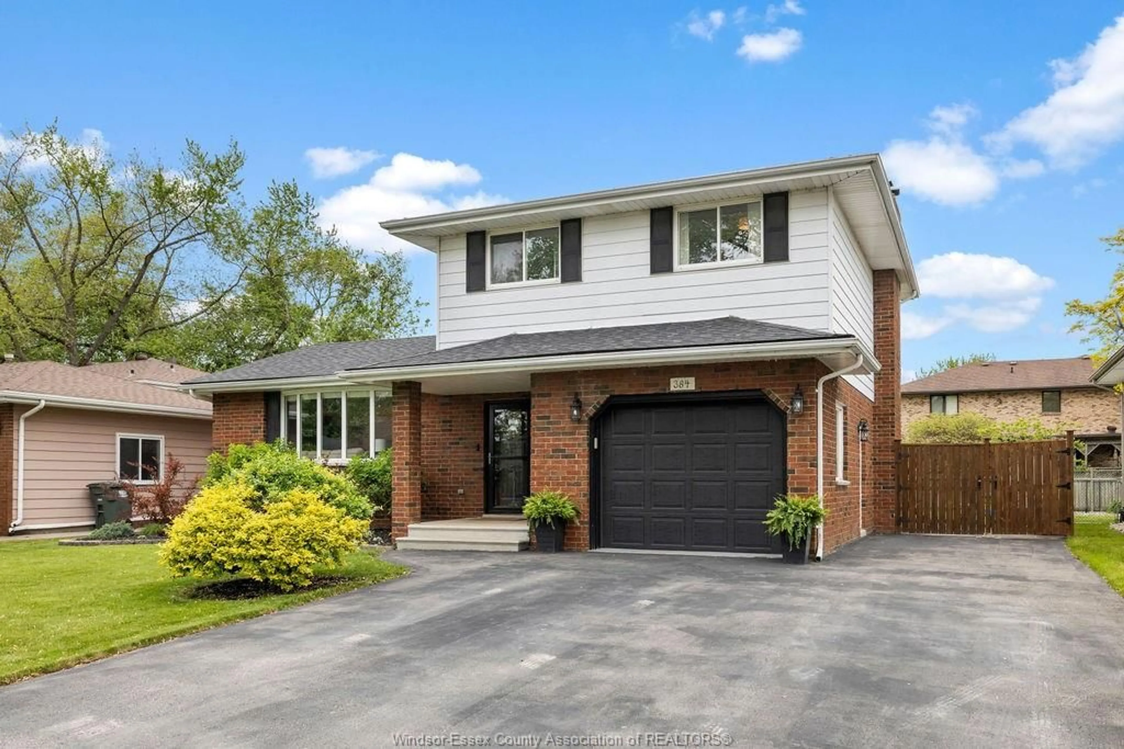 Home with brick exterior material, street for 384 CENTENNIAL Dr, Tecumseh Ontario N8N 2P2