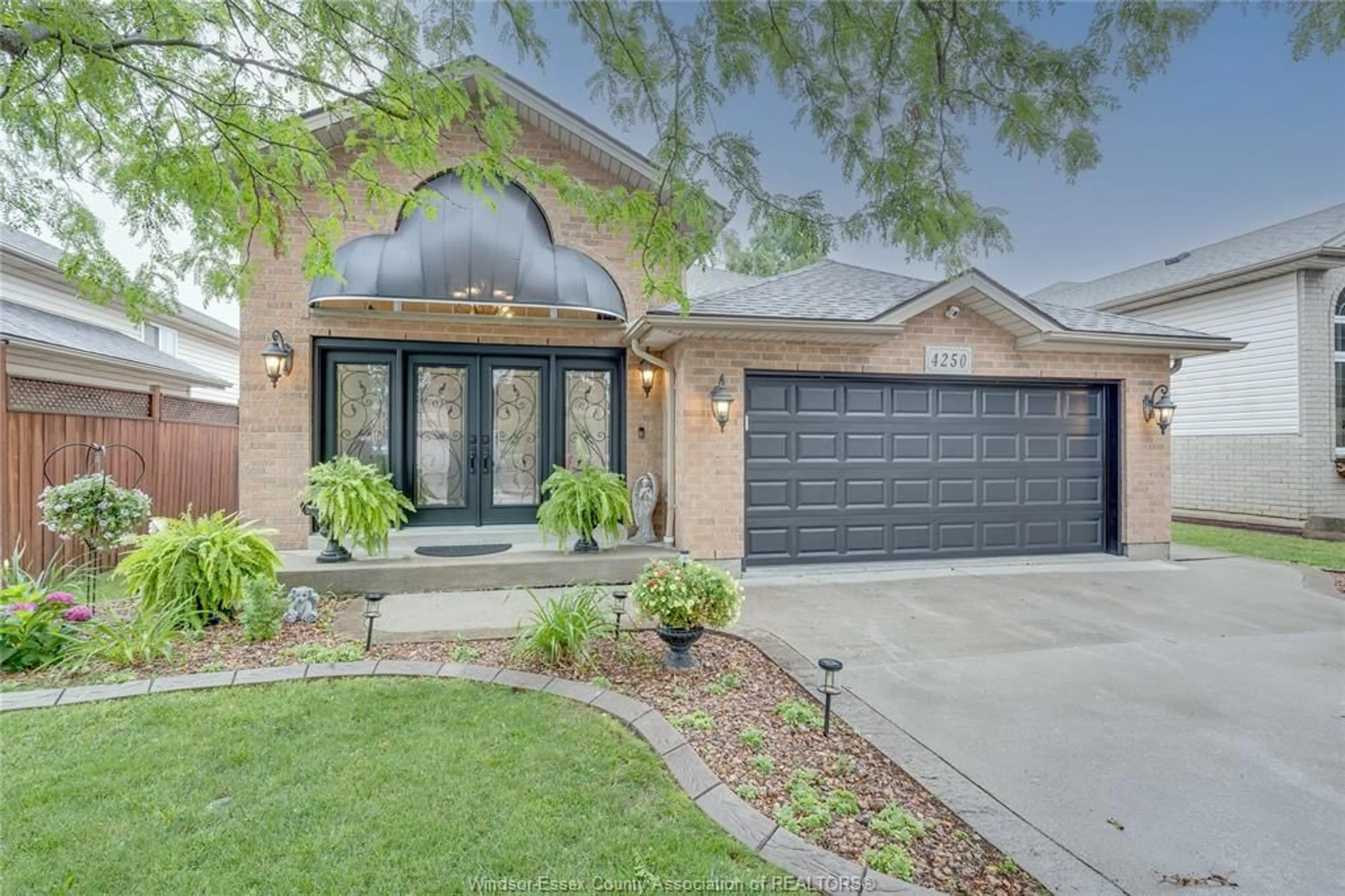 Home with brick exterior material, street for 4250 Canberra, Windsor Ontario N9G 3E8