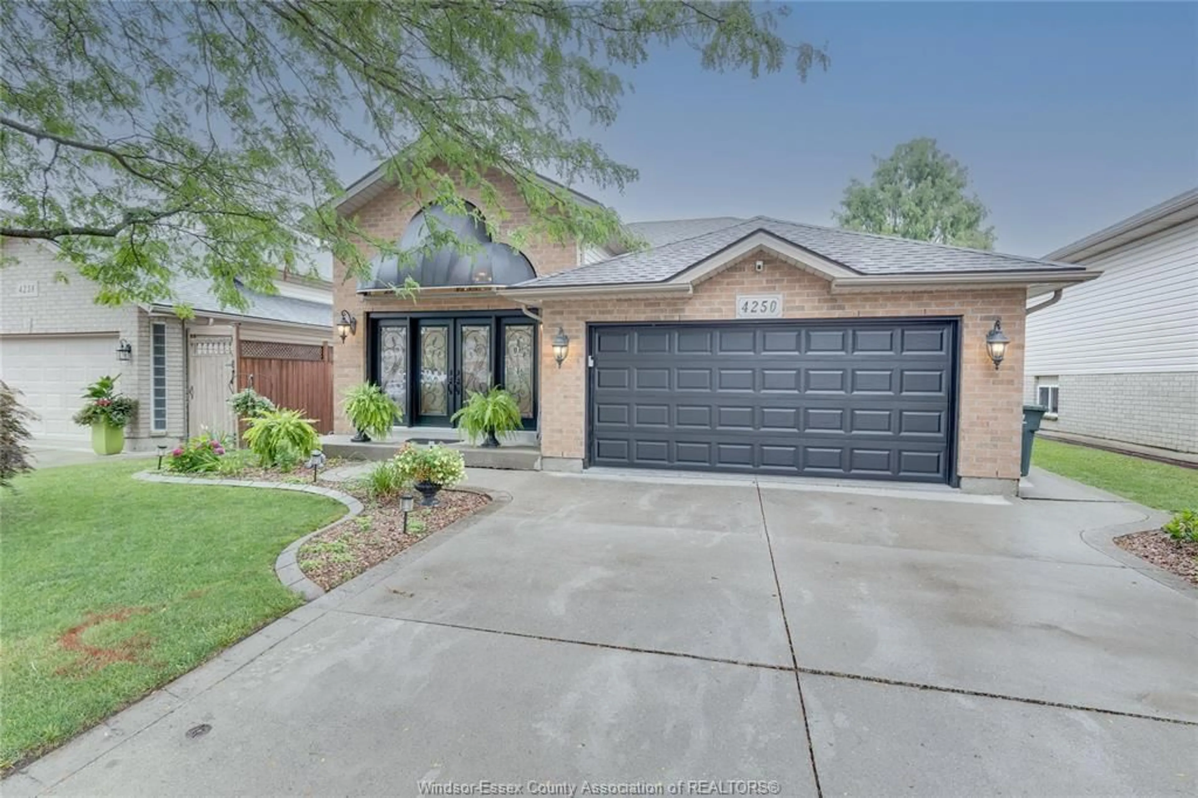Home with brick exterior material, street for 4250 Canberra, Windsor Ontario N9G 3E8