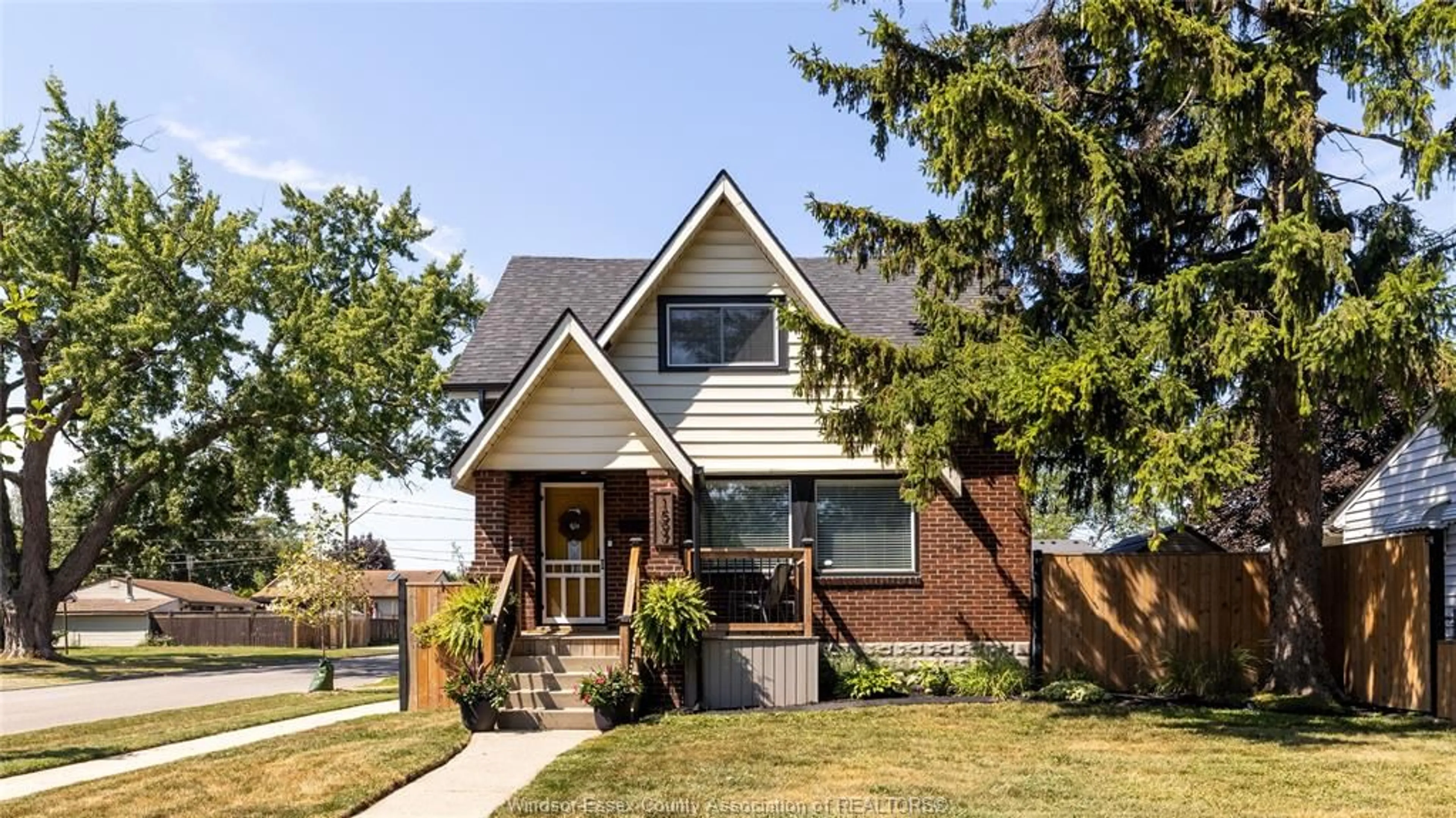 Home with brick exterior material, street for 1597 BERNARD Rd, Windsor Ontario N8Y 4K5