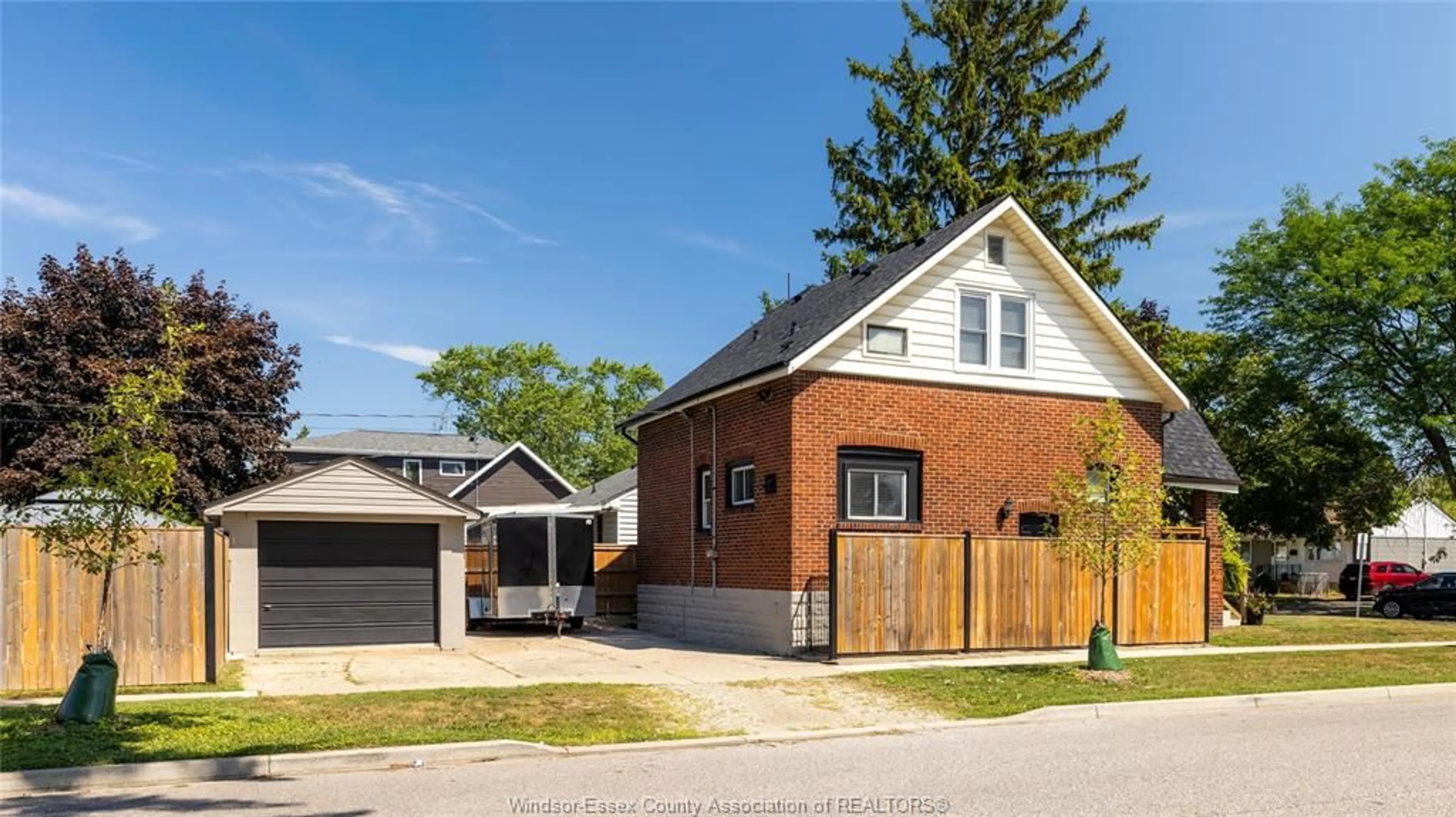 Home with brick exterior material, street for 1597 BERNARD Rd, Windsor Ontario N8Y 4K5