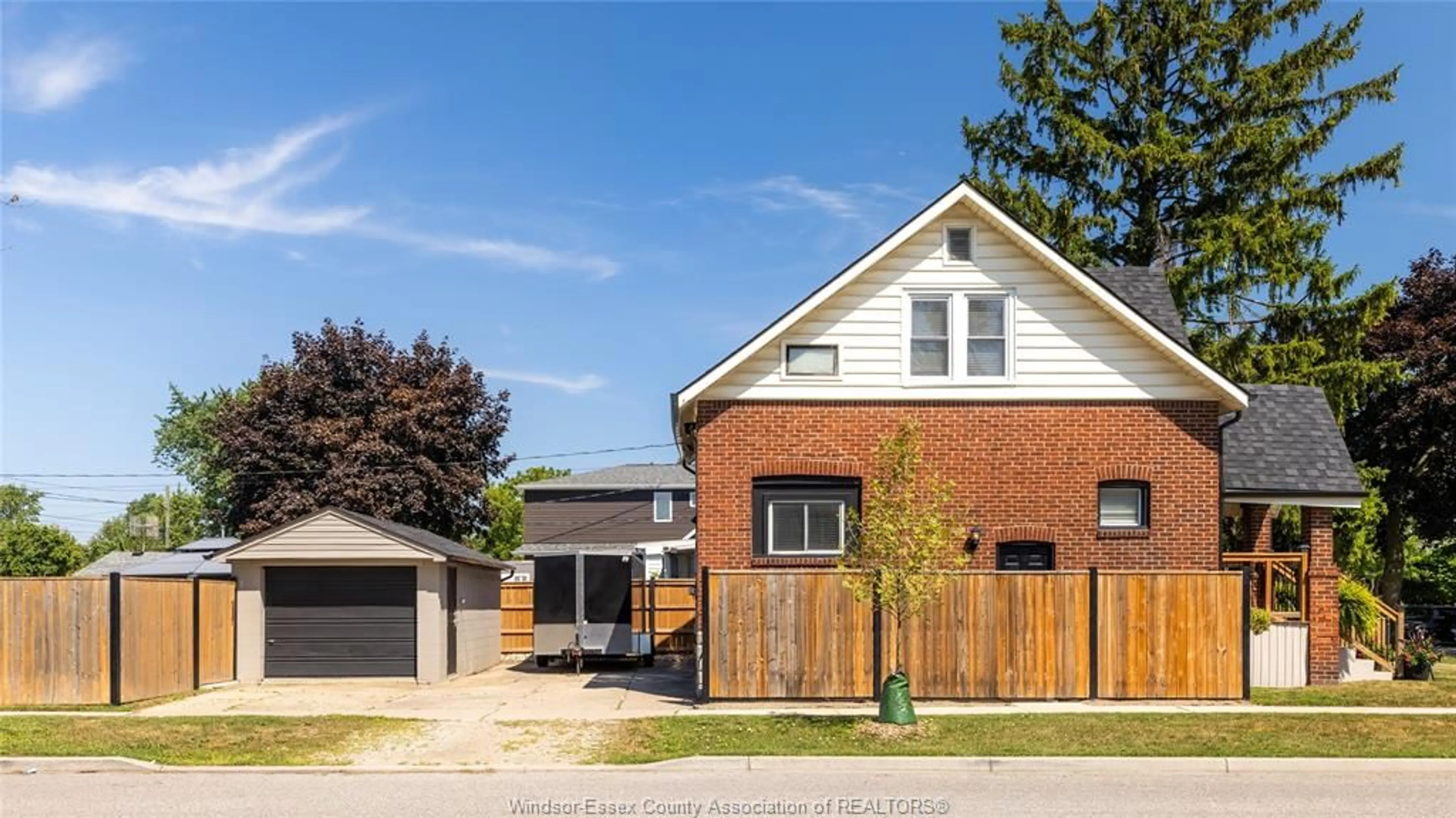 Home with brick exterior material, street for 1597 BERNARD Rd, Windsor Ontario N8Y 4K5