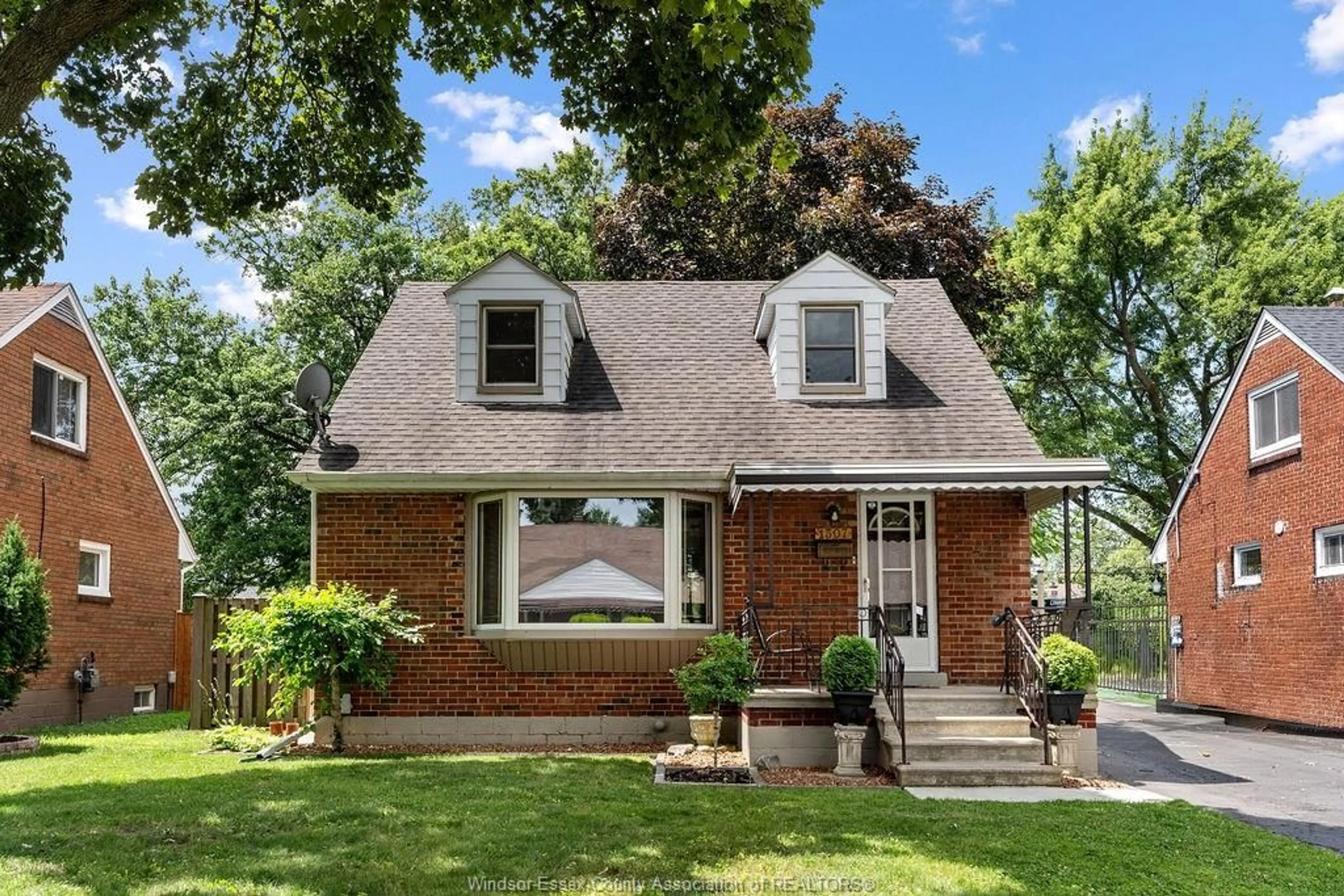 Home with brick exterior material, street for 1307 TILSTON Dr, Windsor Ontario N9B 3C6