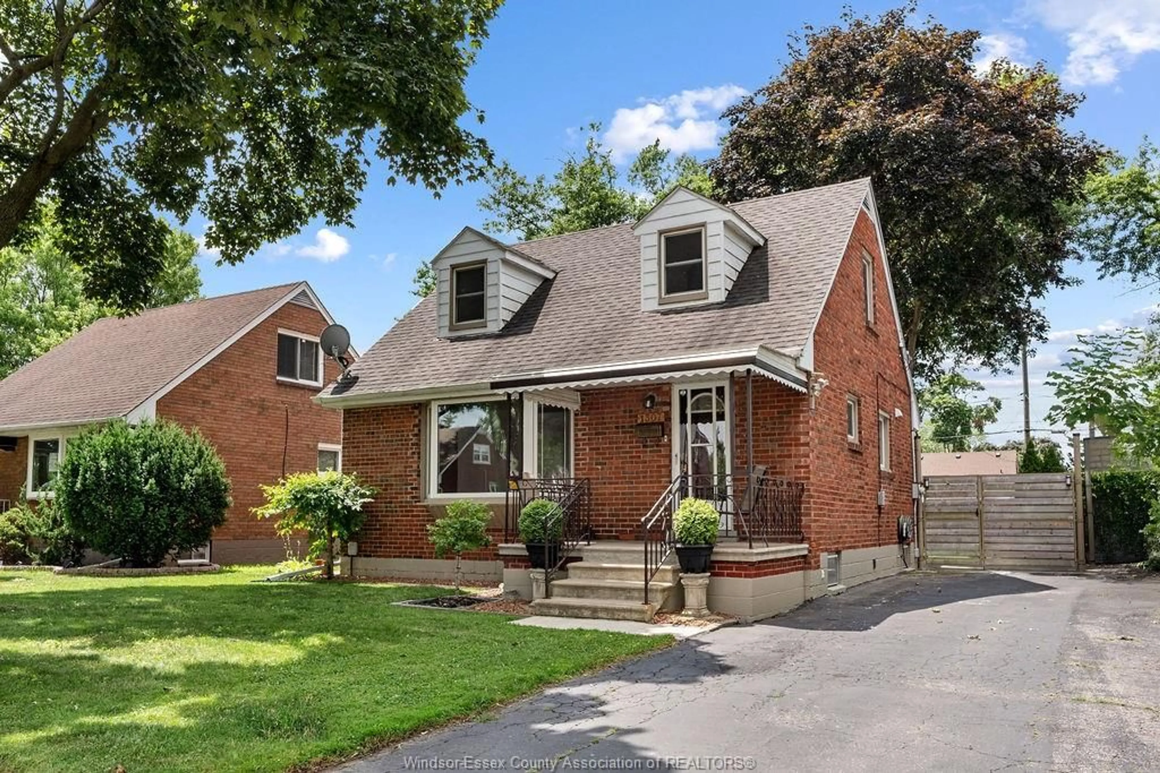 Home with brick exterior material, street for 1307 TILSTON Dr, Windsor Ontario N9B 3C6