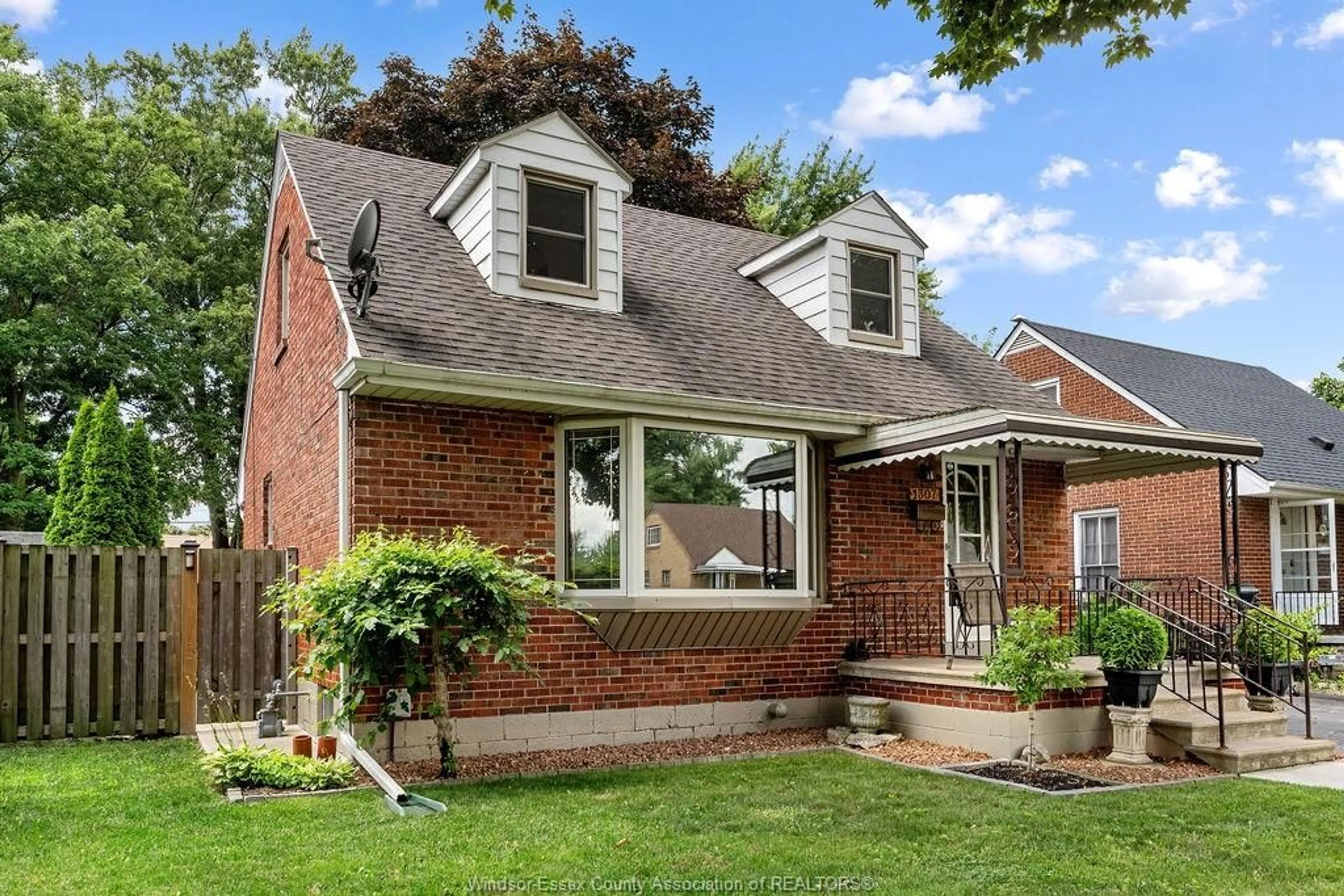 Home with brick exterior material, street for 1307 TILSTON Dr, Windsor Ontario N9B 3C6