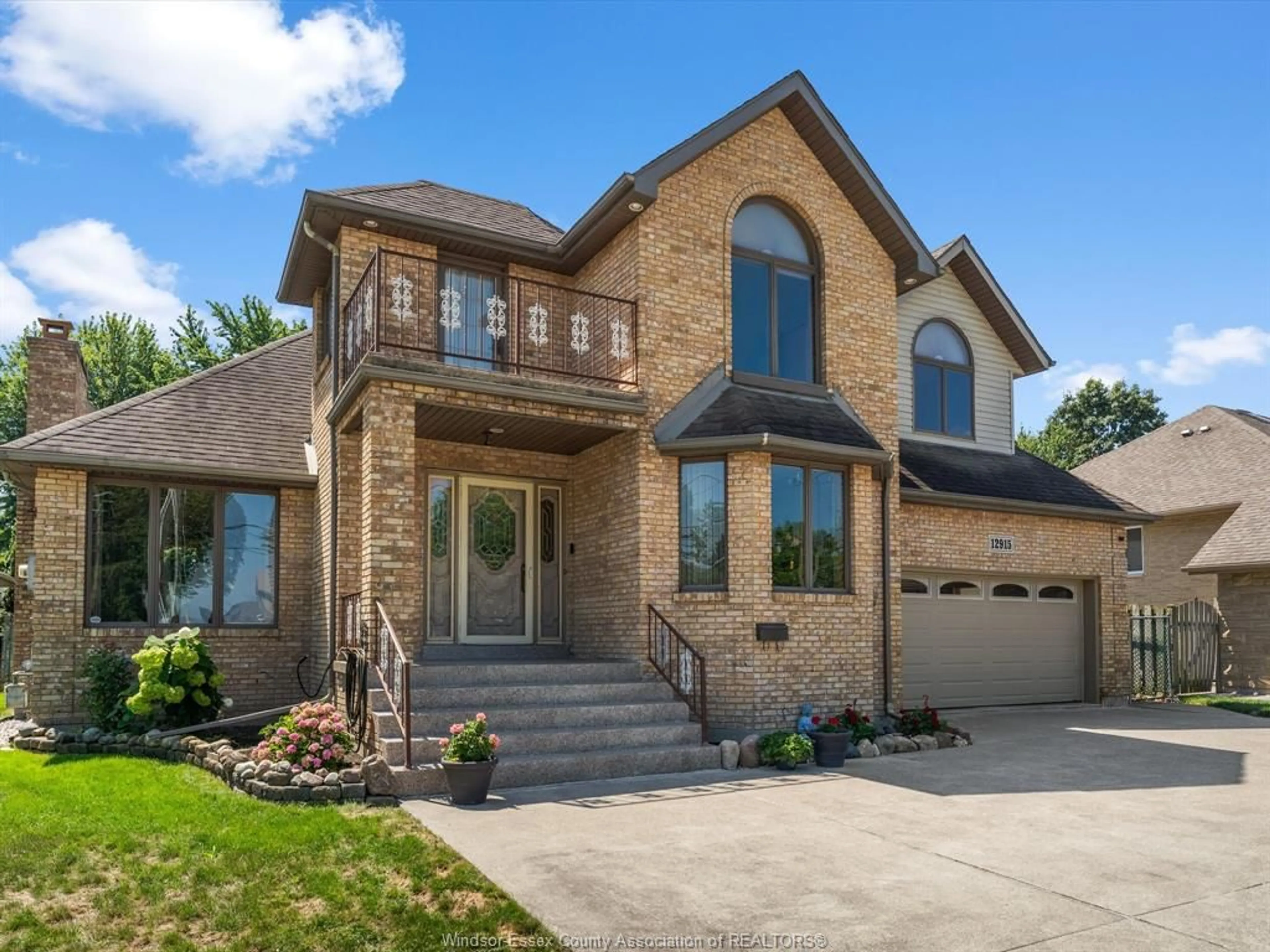 Home with brick exterior material, street for 12915 RIVERSIDE Dr, Tecumseh Ontario N8N 1A9