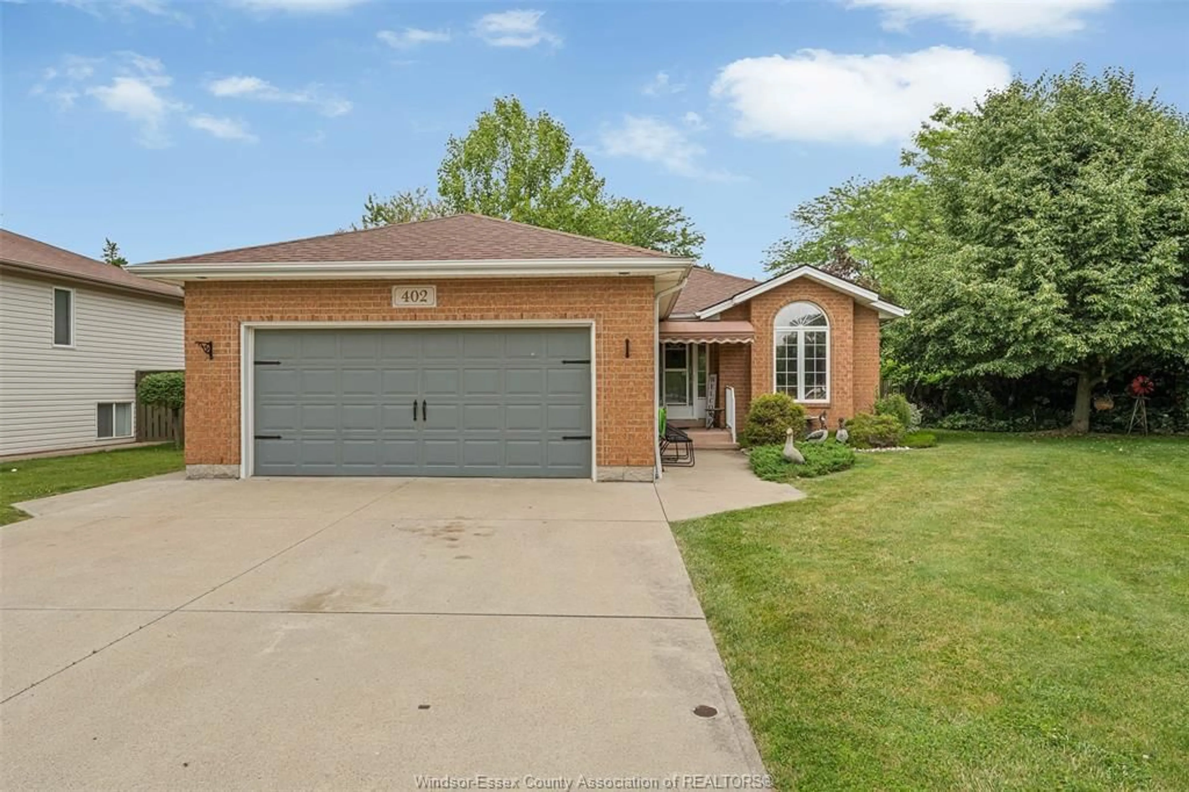 Home with brick exterior material, street for 402 THORNRIDGE Cres, Amherstburg Ontario N9V 3X2