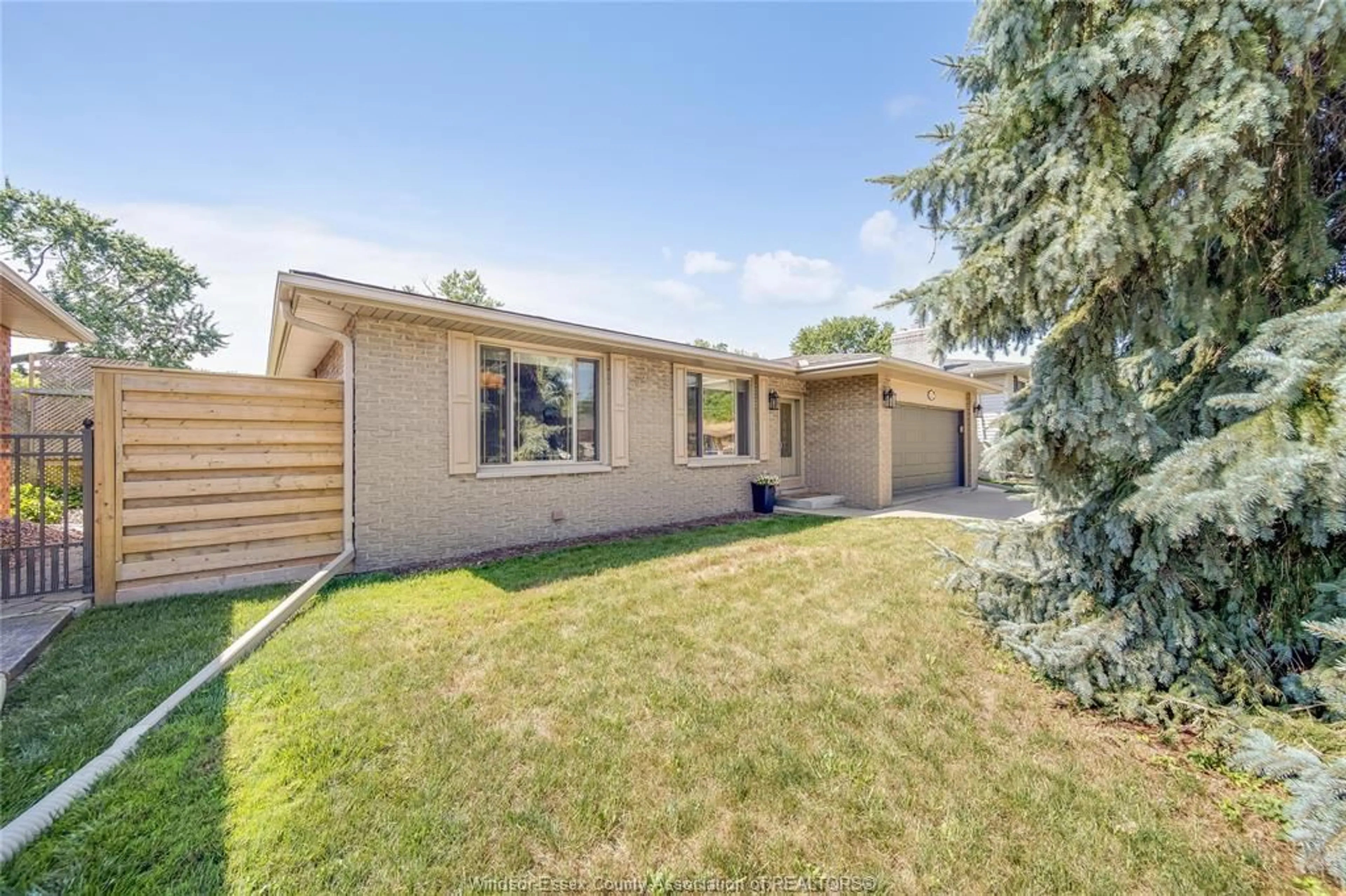 Home with brick exterior material, street for 12227 CEDARWOOD Dr, Tecumseh Ontario N8N 2W1