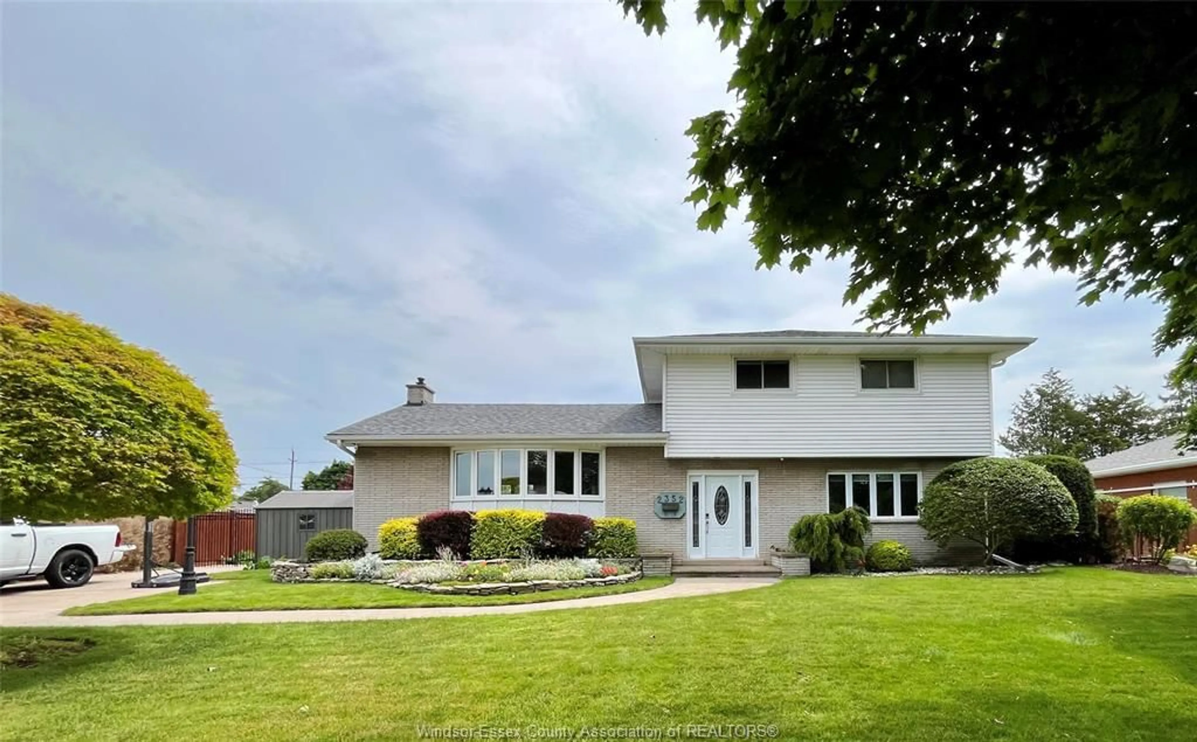 Home with vinyl exterior material, street for 2352 LEONARD Rd, Windsor Ontario N8W 4L7
