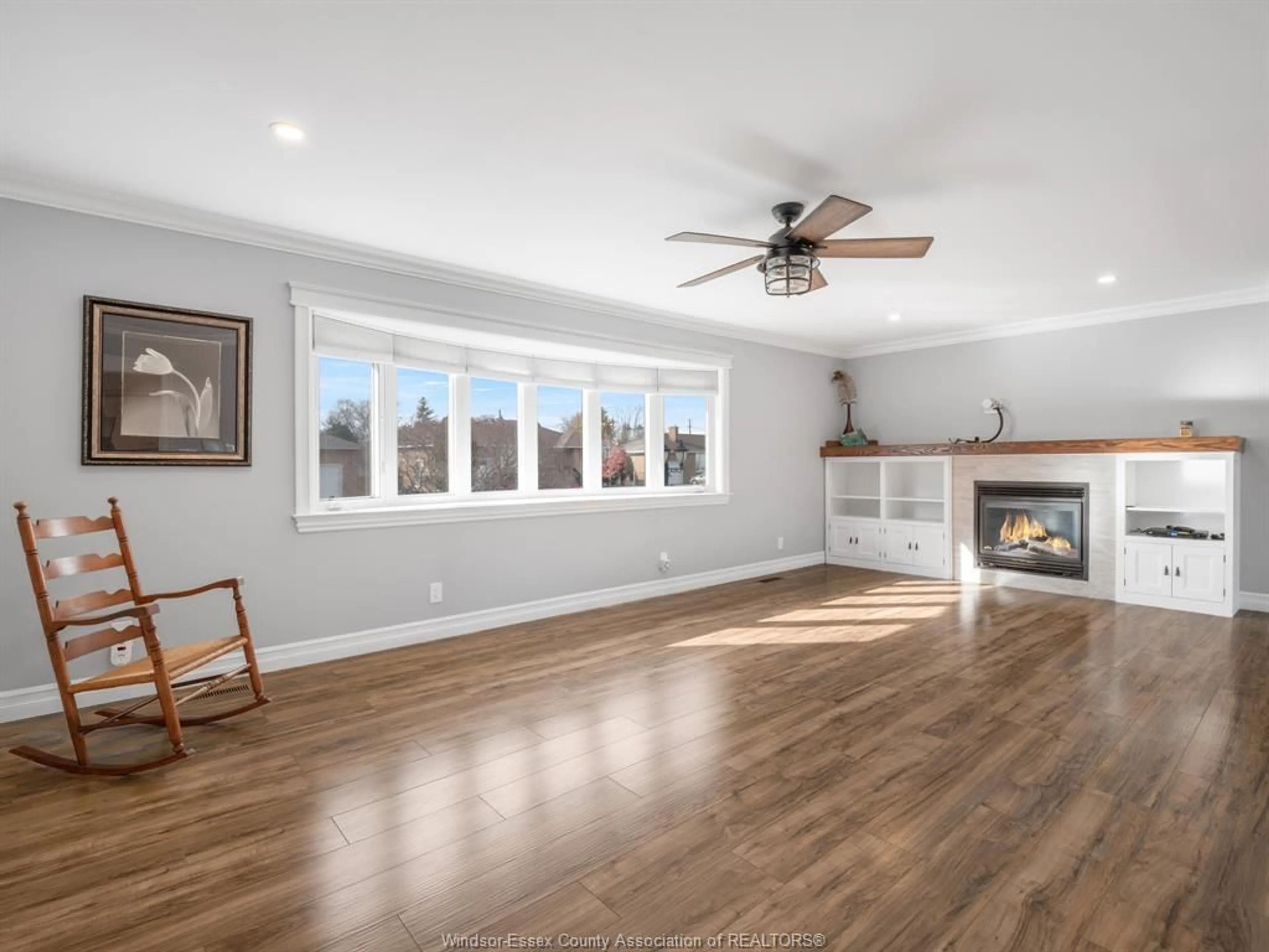 Living room with furniture, wood/laminate floor for 2352 LEONARD Rd, Windsor Ontario N8W 4L7