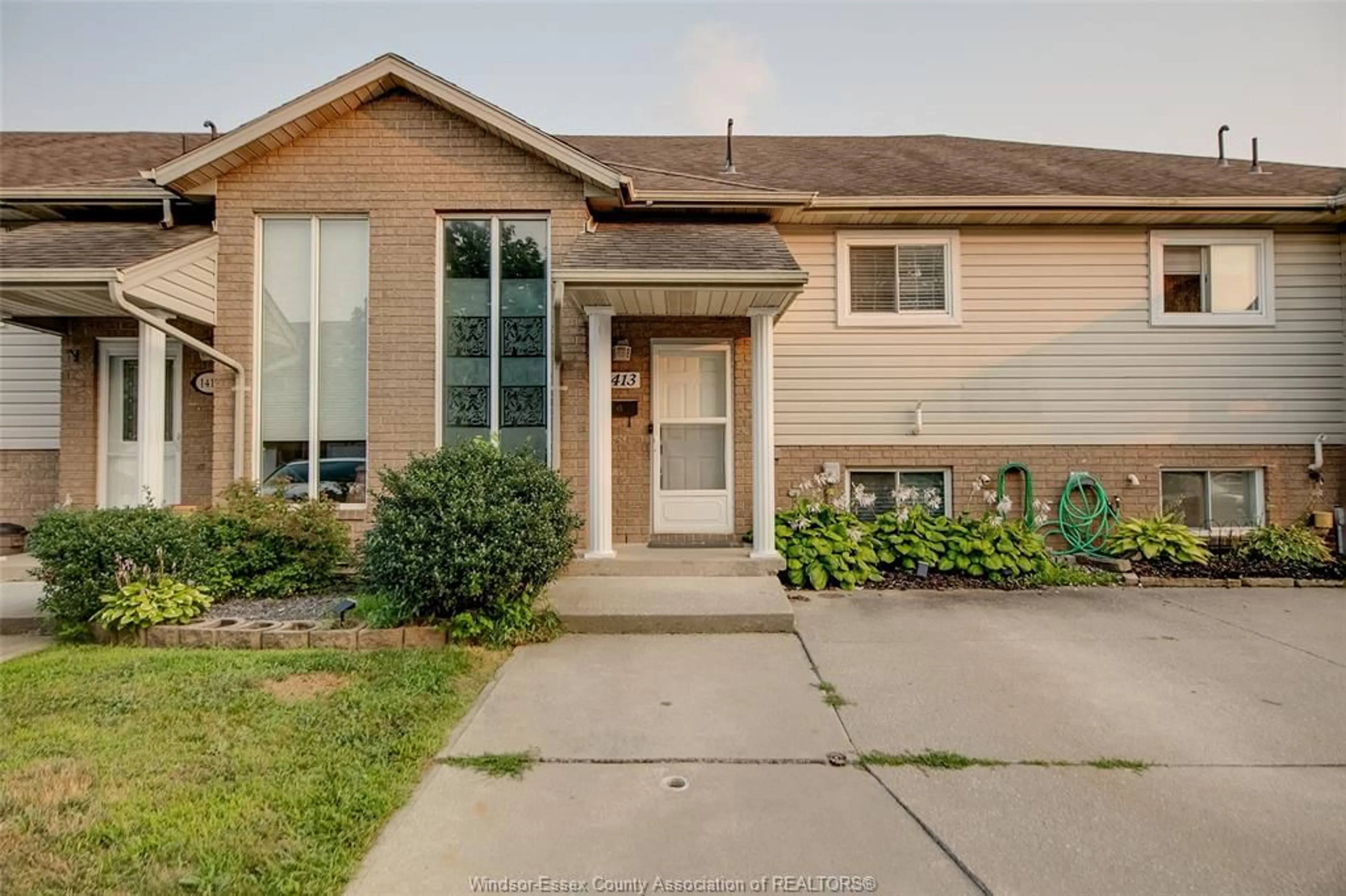 Home with brick exterior material, street for 1413 MICKAILA Cres, Tecumseh Ontario N8N 4Z2