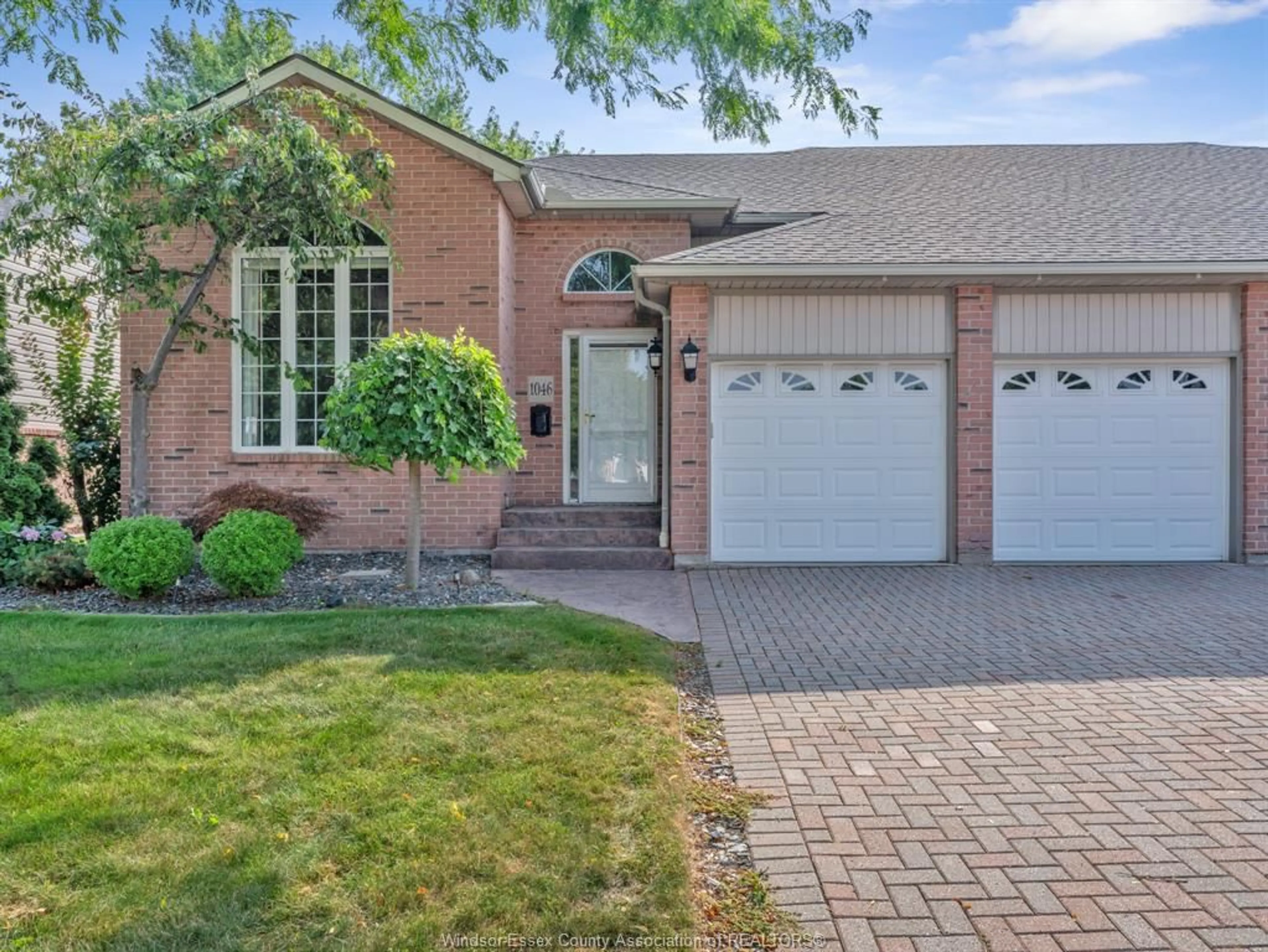 Home with brick exterior material, street for 1046 Rendezvous Dr, Windsor Ontario N8P 1K6