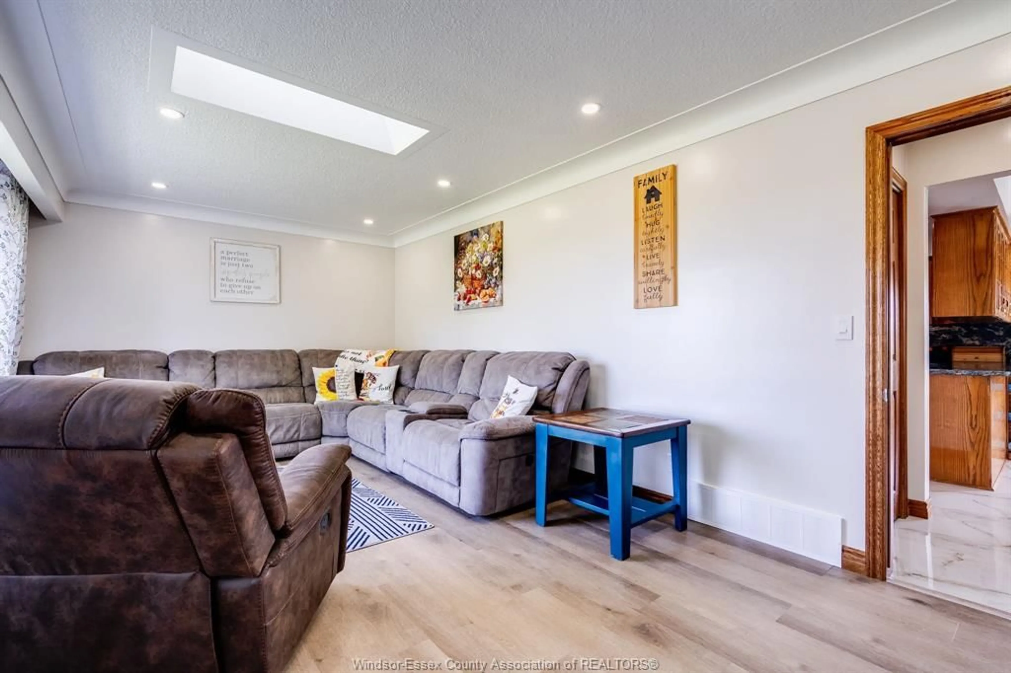 Living room with furniture, wood/laminate floor for 252 Road 7, Ruthven Ontario N0P 2G0