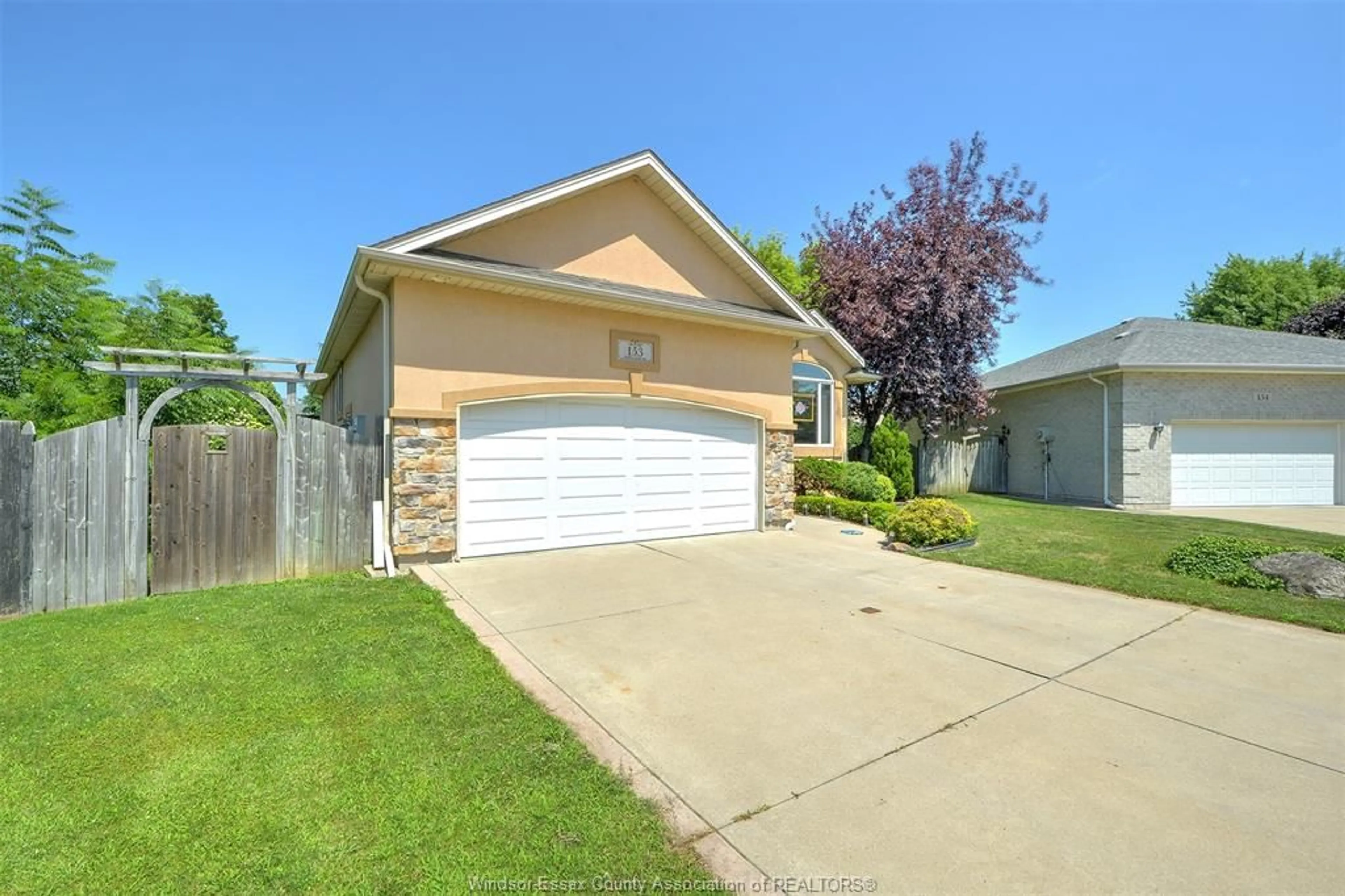 Home with vinyl exterior material, street for 153 PURPLE PLUM Dr, Kingsville Ontario N9Y 3P5