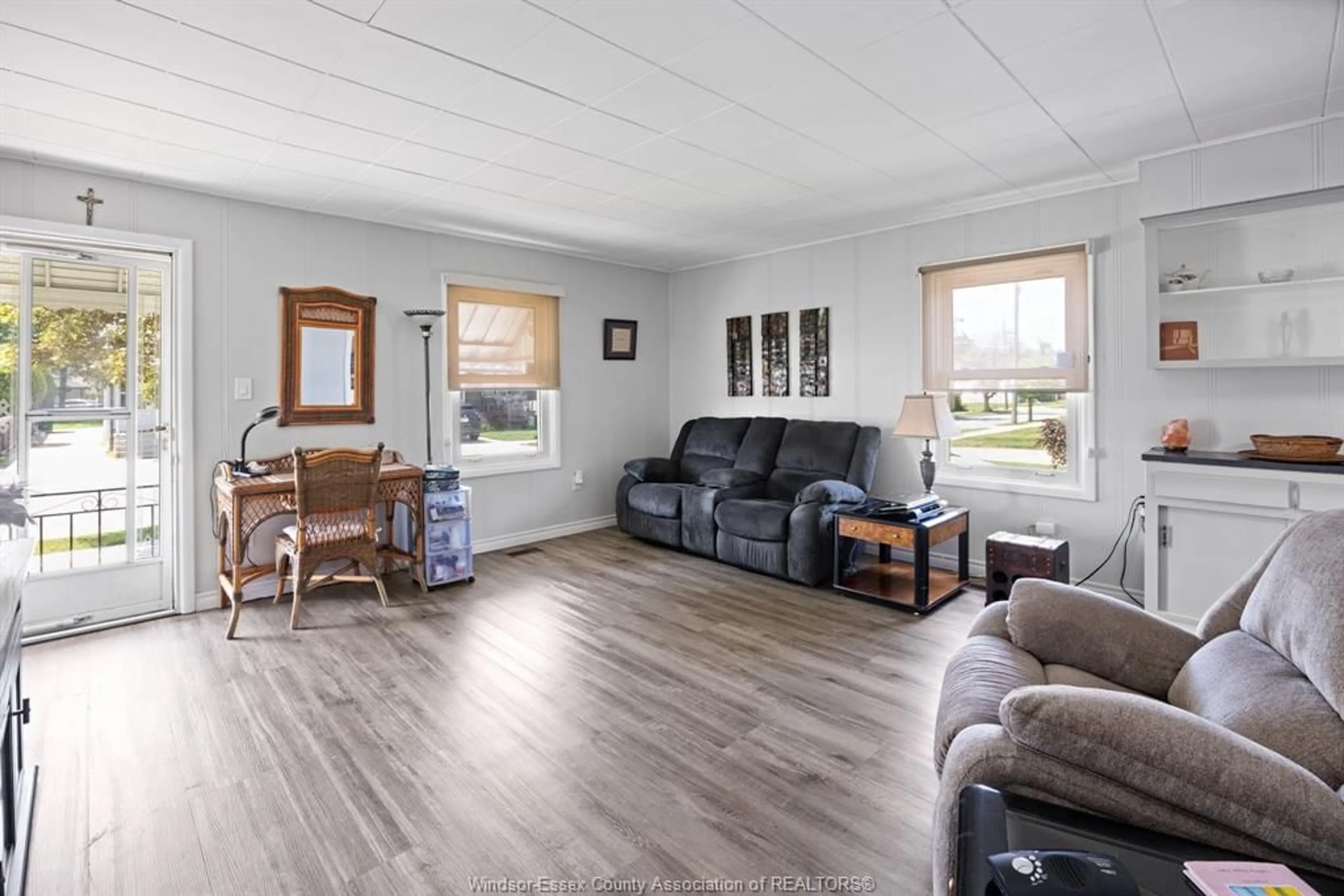 Living room with furniture, wood/laminate floor for 2426 MERCER St, Windsor Ontario N8X 3R5
