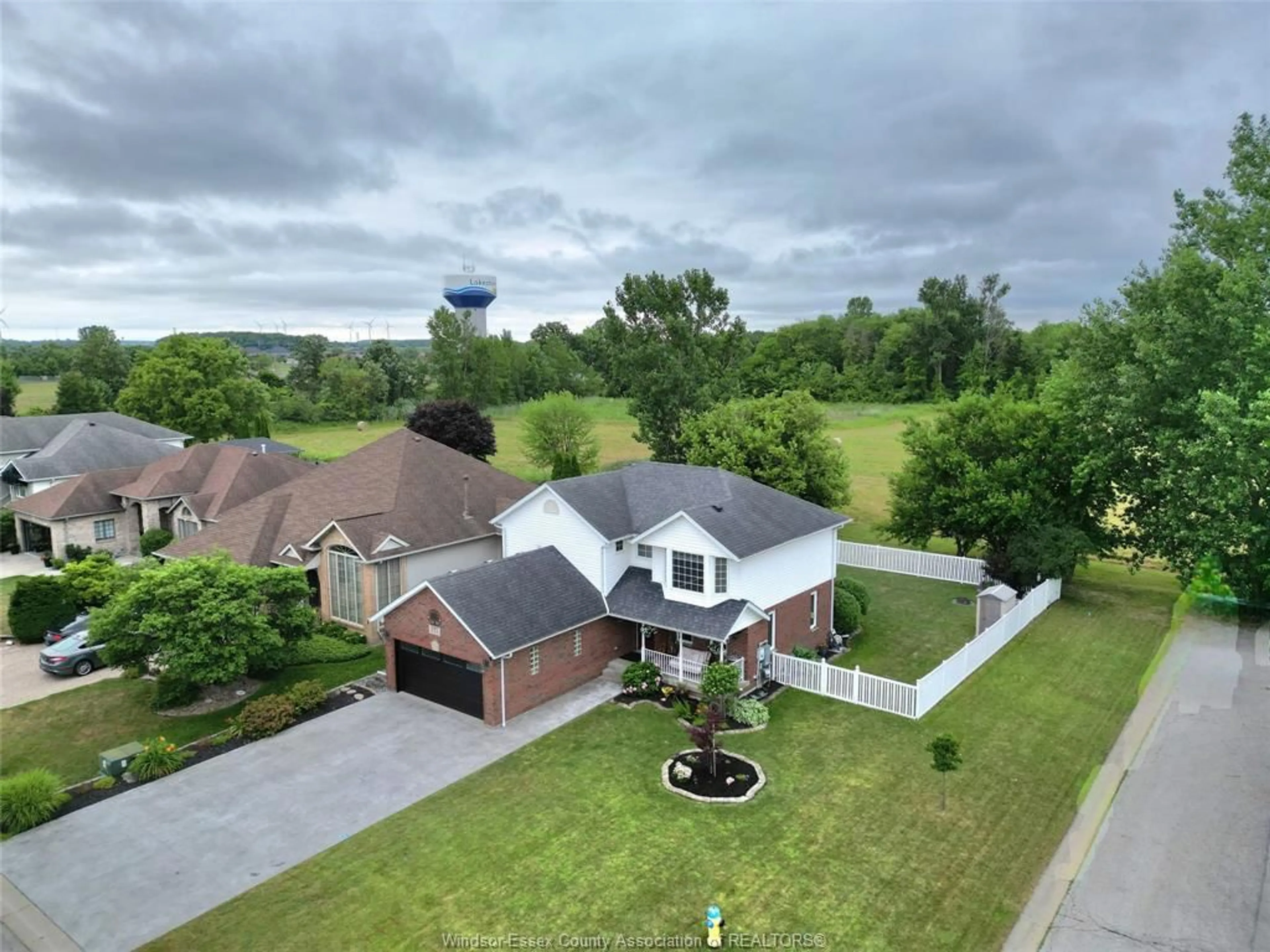 A pic from outside/outdoor area/front of a property/back of a property/a pic from drone, water/lake/river/ocean view for 211 BAYBERRY, Lakeshore Ontario N0R 1A0