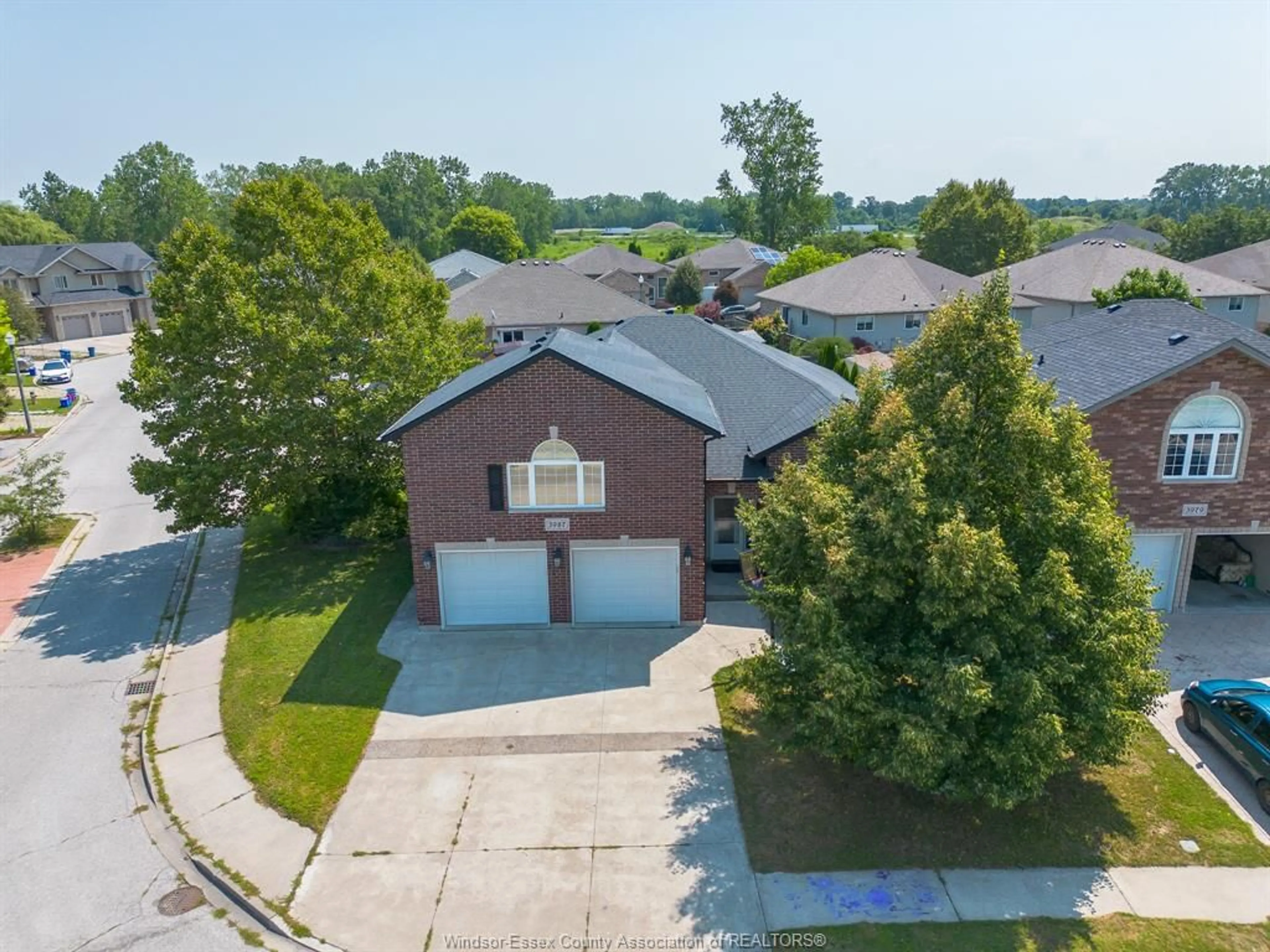 A pic from outside/outdoor area/front of a property/back of a property/a pic from drone, street for 3987 WILDWOOD Dr, Windsor Ontario N8R 2L1