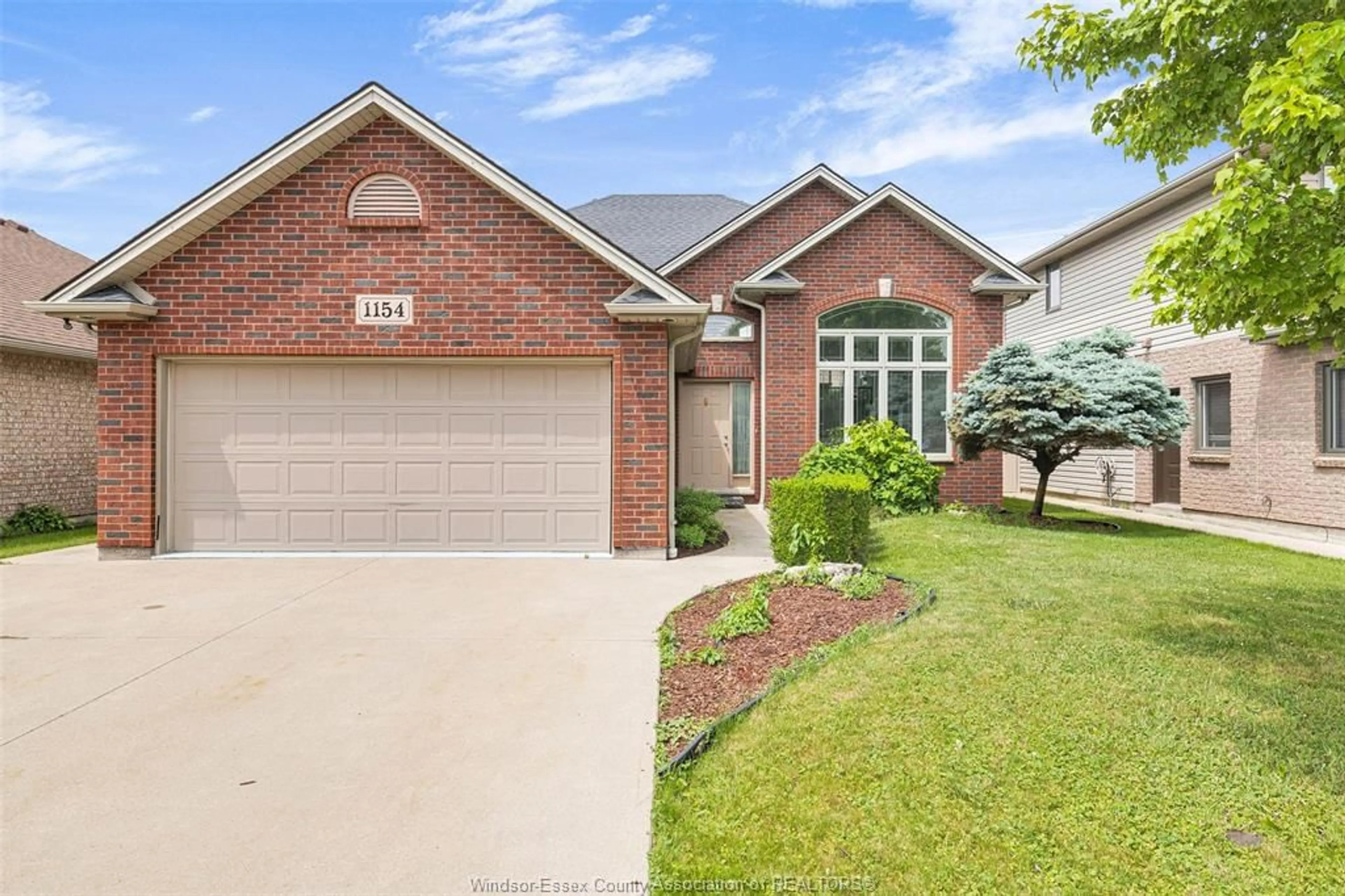 Home with brick exterior material, street for 1154 MONARCH MEADOWS, Lakeshore Ontario N0R 1A0