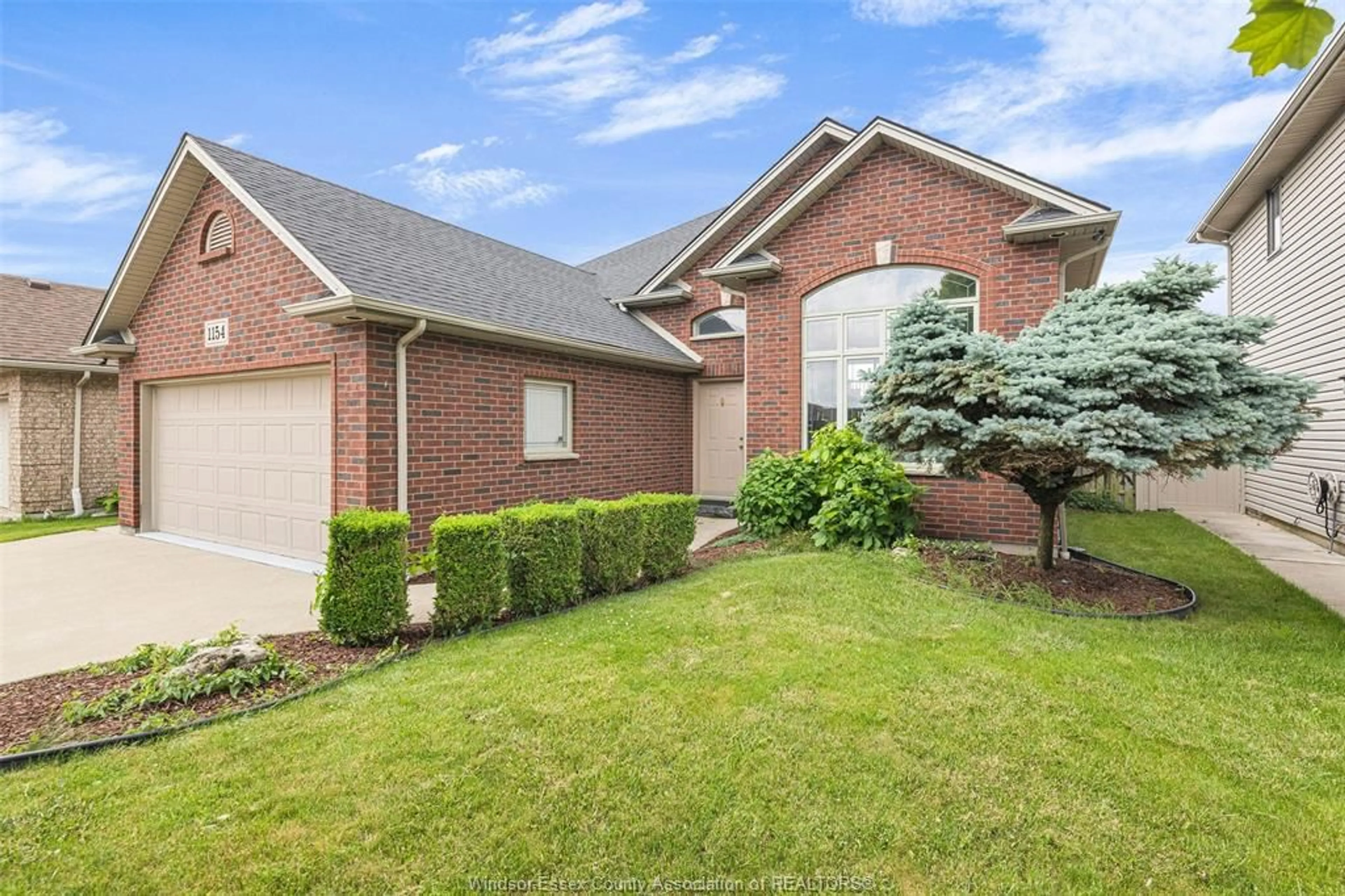 Home with brick exterior material, street for 1154 MONARCH MEADOWS, Lakeshore Ontario N0R 1A0