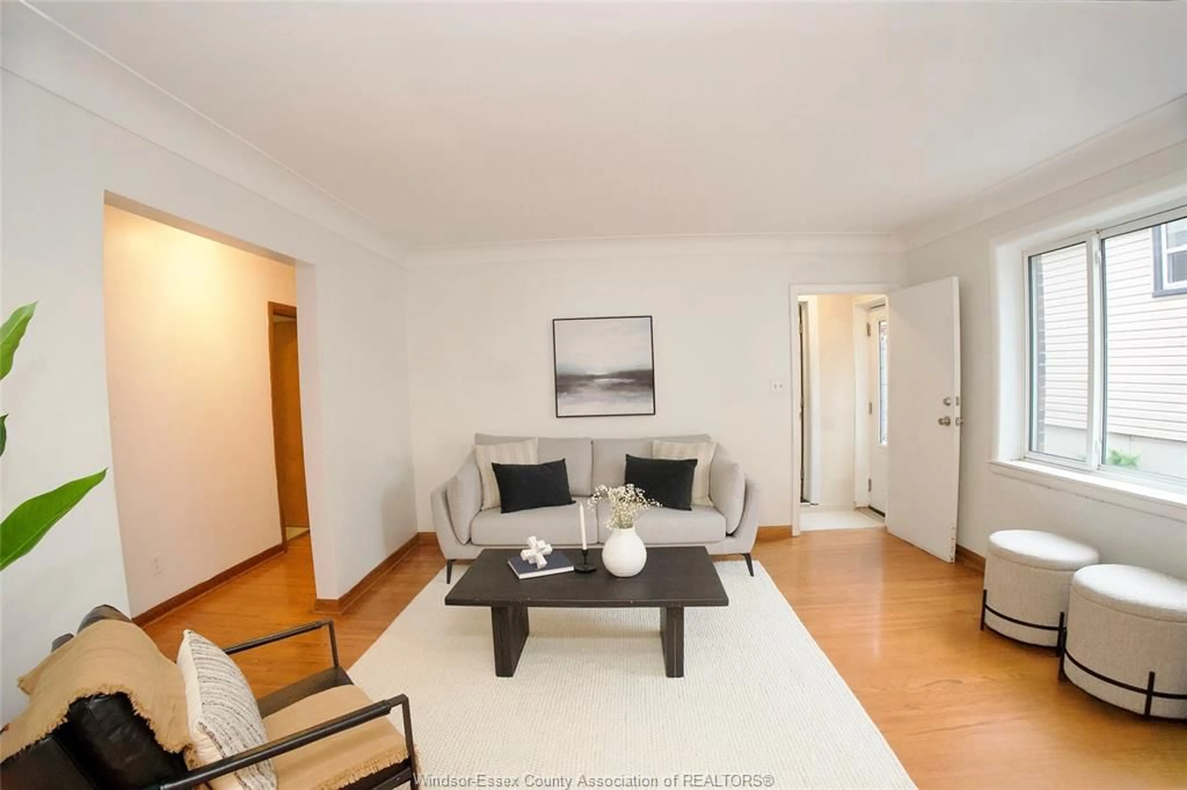 Living room with furniture, wood/laminate floor for 1637 DROUILLARD, Windsor Ontario N8Y 2S4