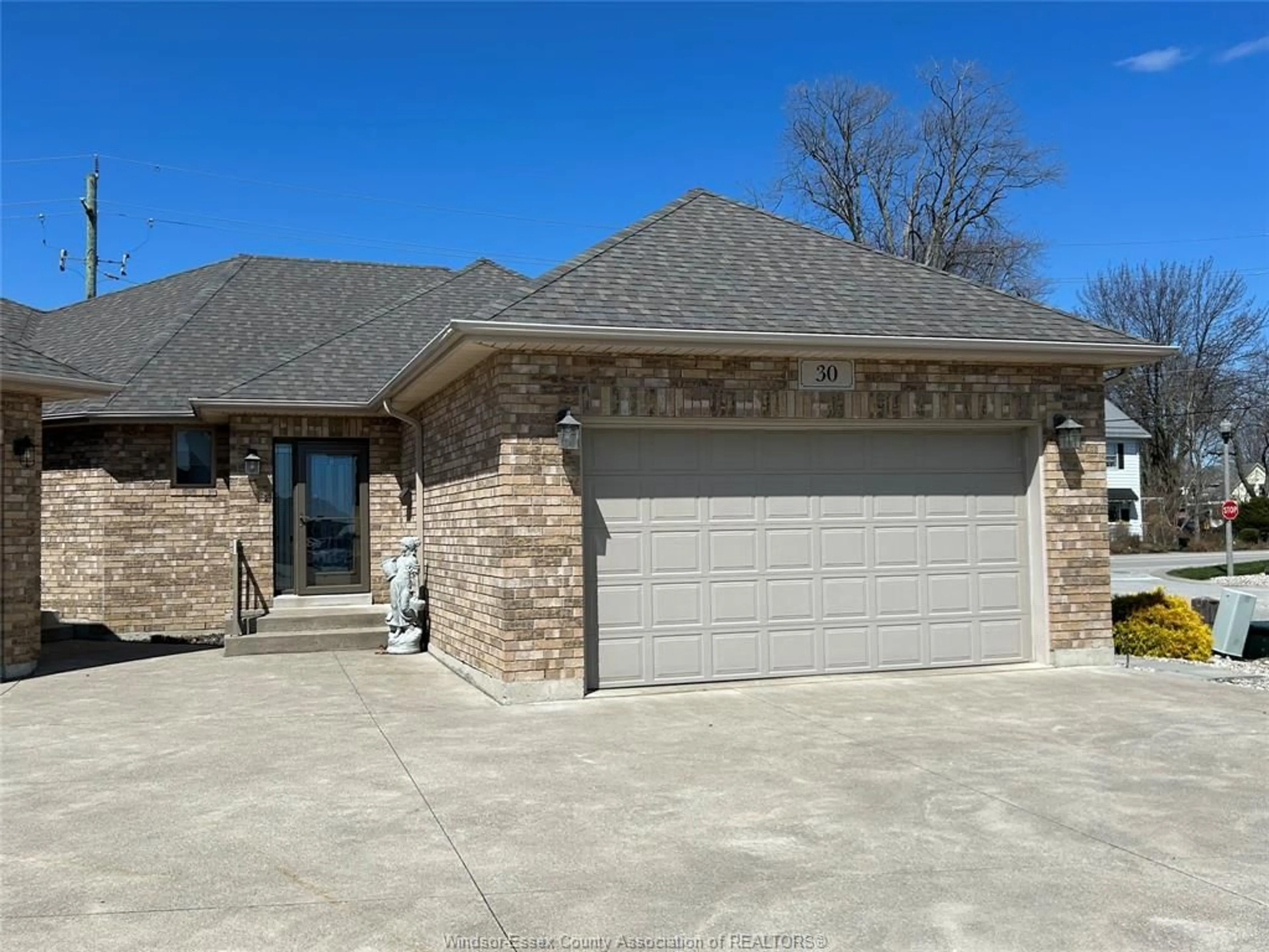 Home with brick exterior material, street for 30 METTAWAS Lane, Kingsville Ontario N9Y 0A2