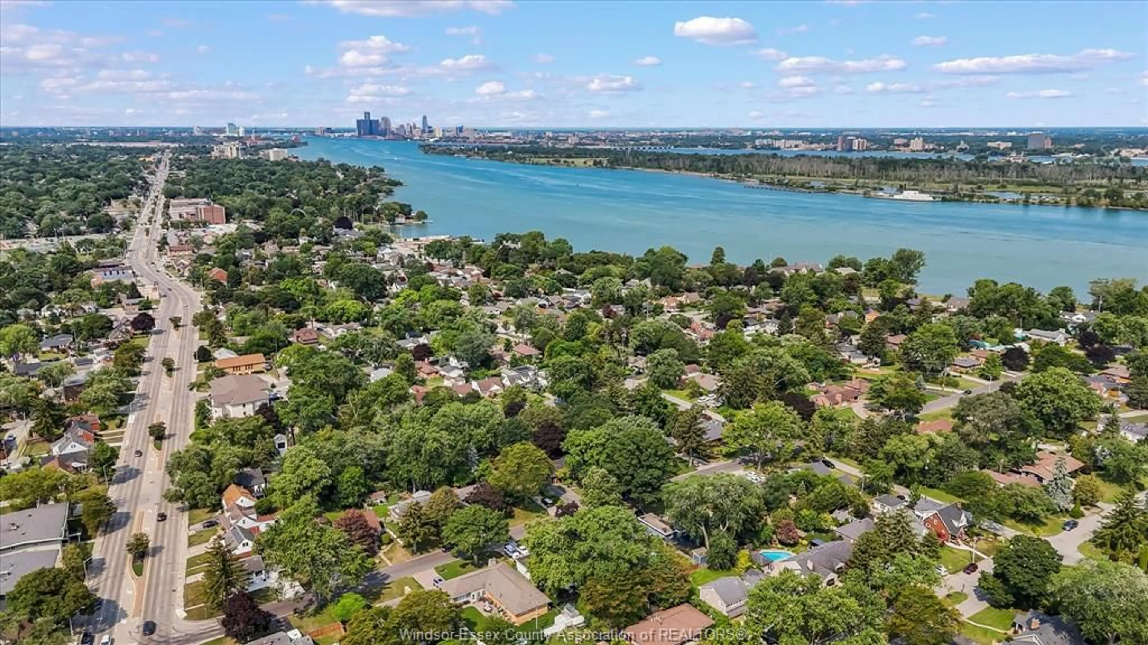 A pic from outside/outdoor area/front of a property/back of a property/a pic from drone, water/lake/river/ocean view for 411 BELLE ISLE Blvd, Windsor Ontario N8S 3G2