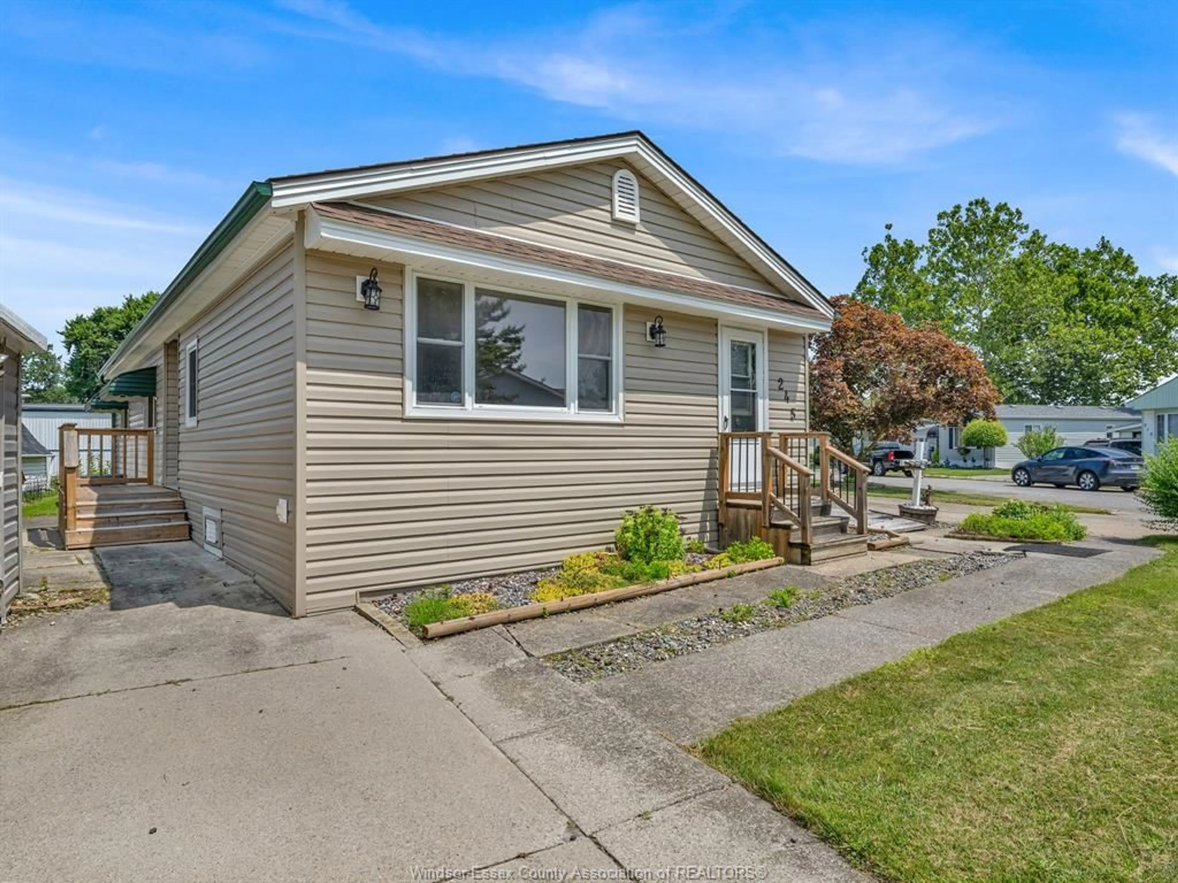 Home with vinyl exterior material, street for 245 BEVERLY, Essex Ontario N8M 2B4