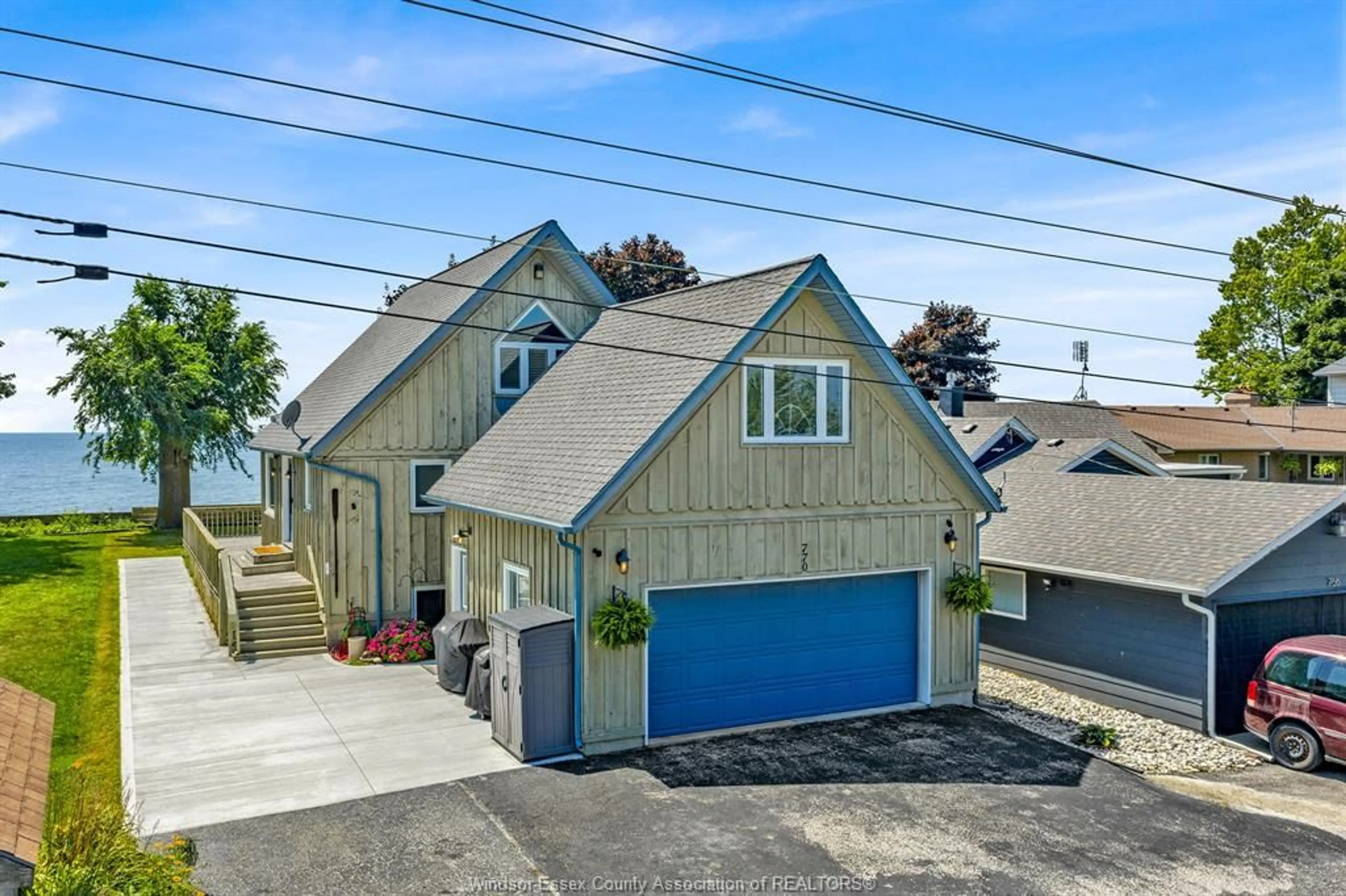 A pic from outside/outdoor area/front of a property/back of a property/a pic from drone, street for 770 Point Pelee Dr, Leamington Ontario N8H 3V4