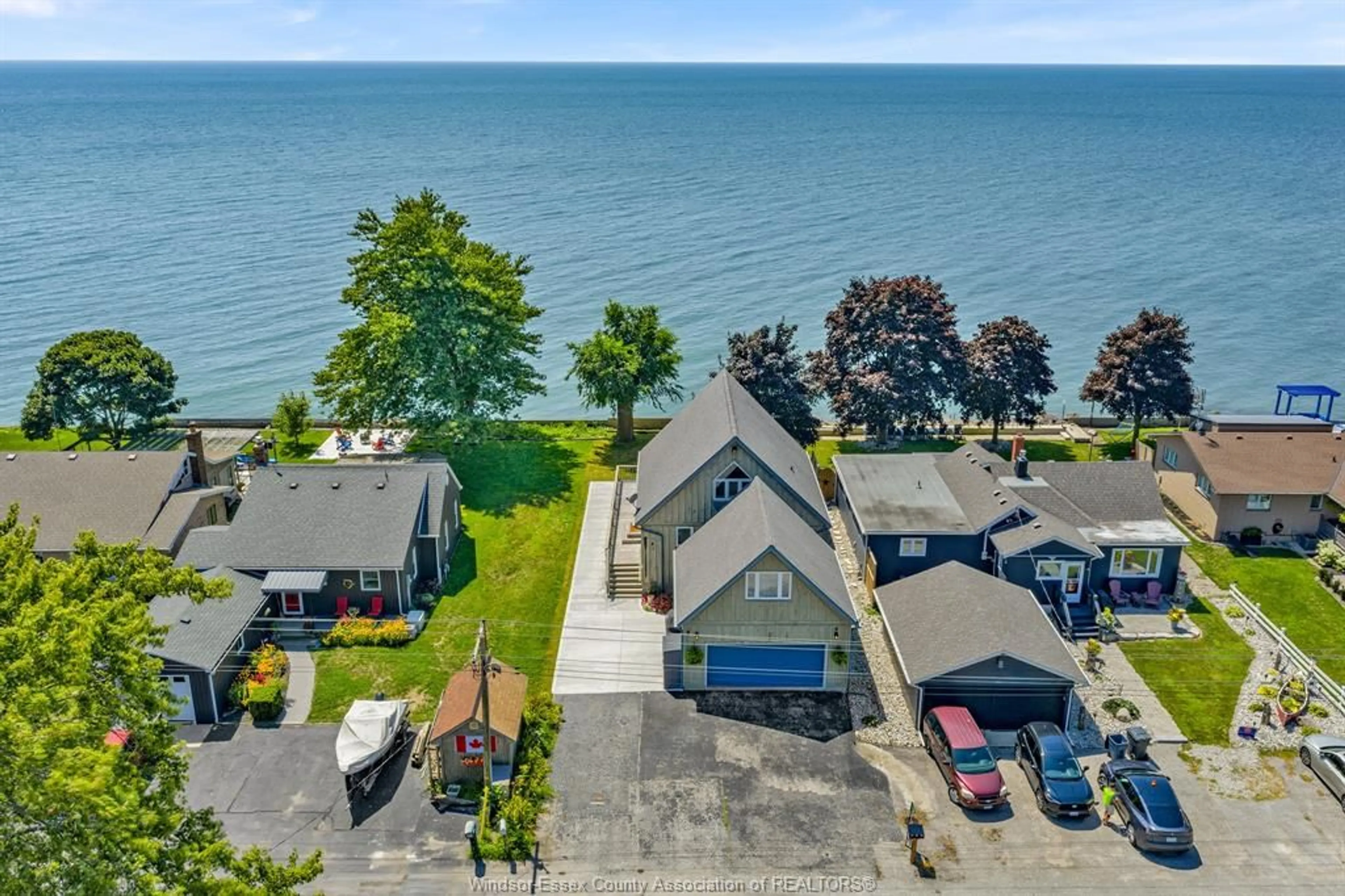 A pic from outside/outdoor area/front of a property/back of a property/a pic from drone, water/lake/river/ocean view for 770 Point Pelee Dr, Leamington Ontario N8H 3V4